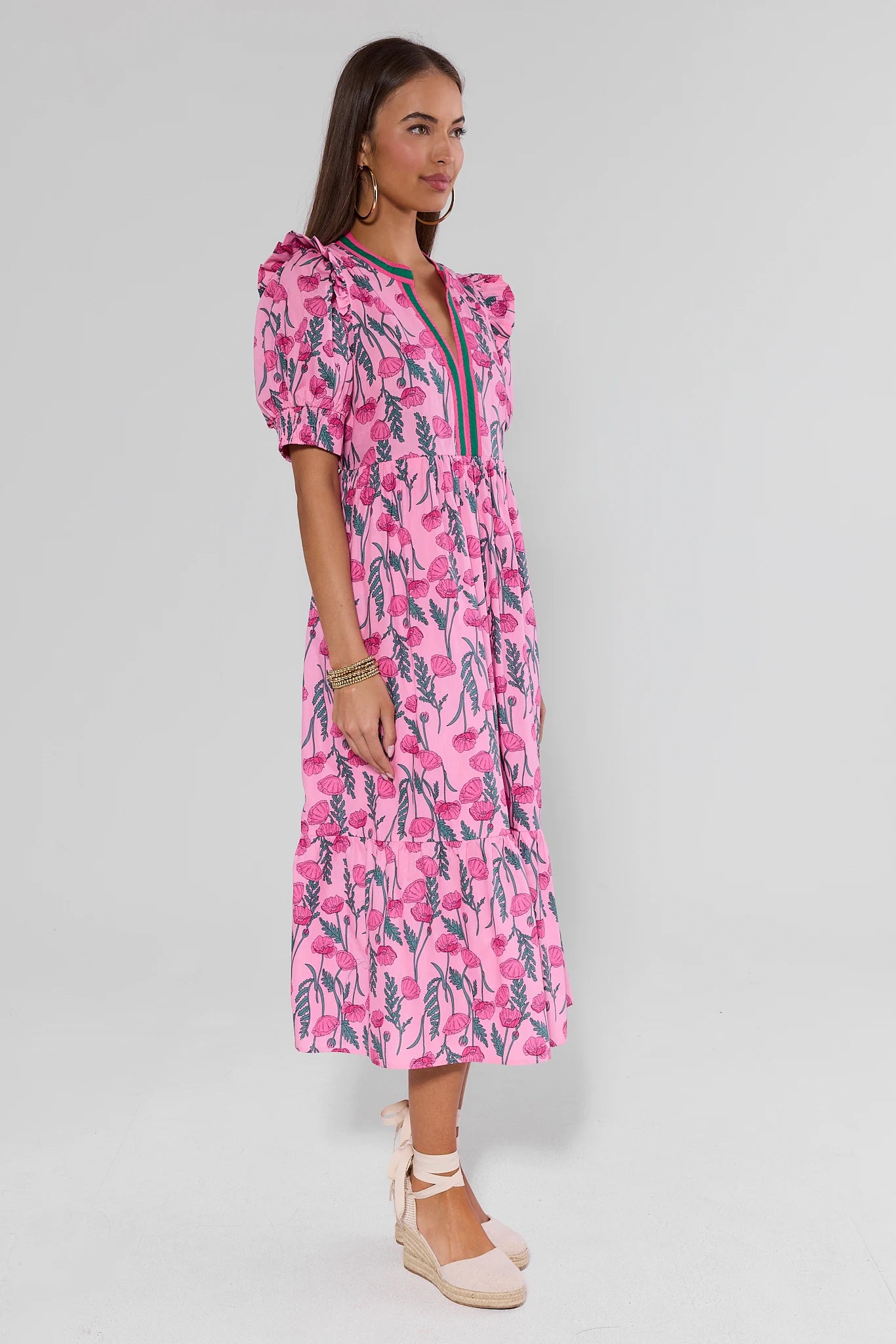 Woman wearing a pink dress on a background