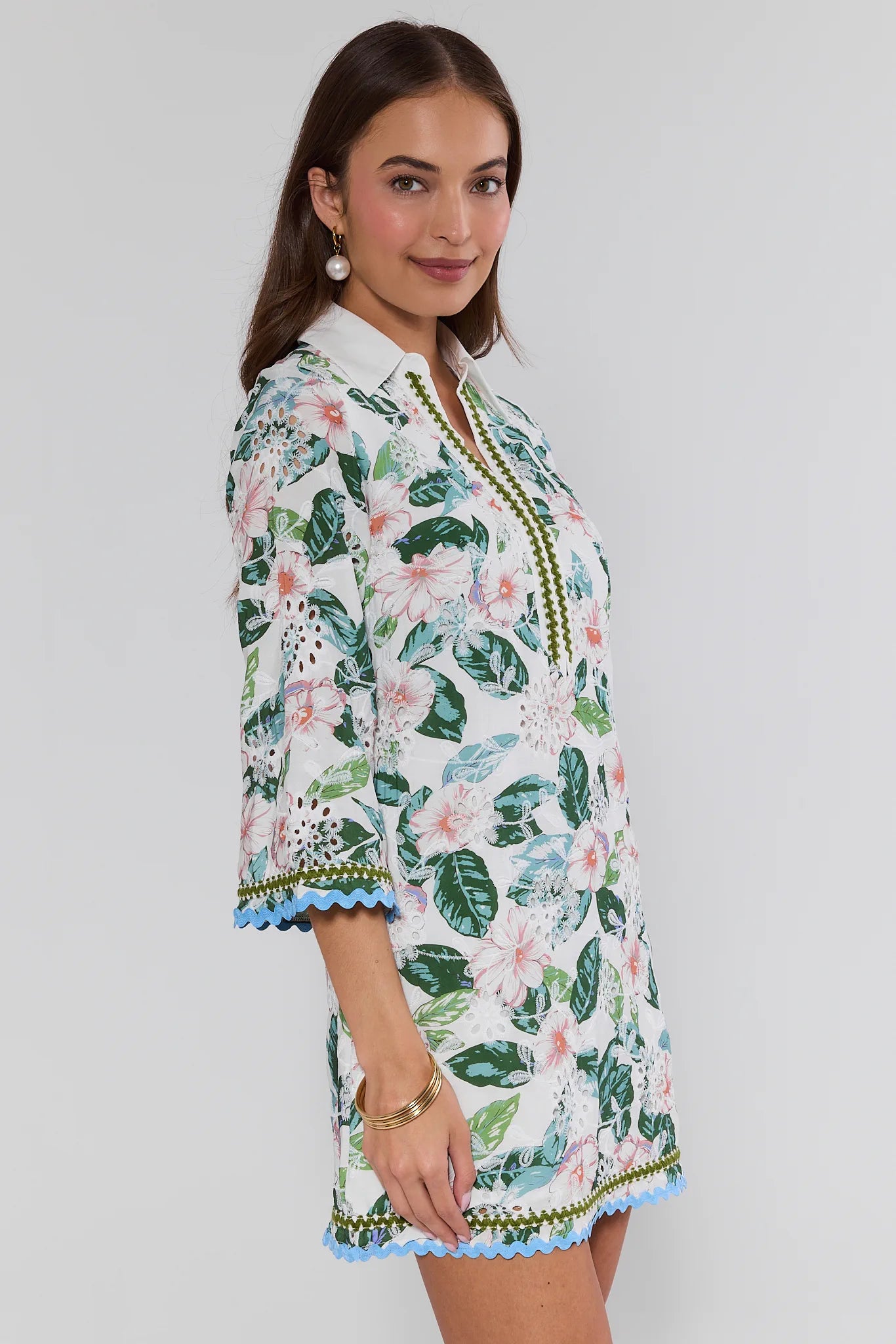 Woman wearing a floral dress with a white background