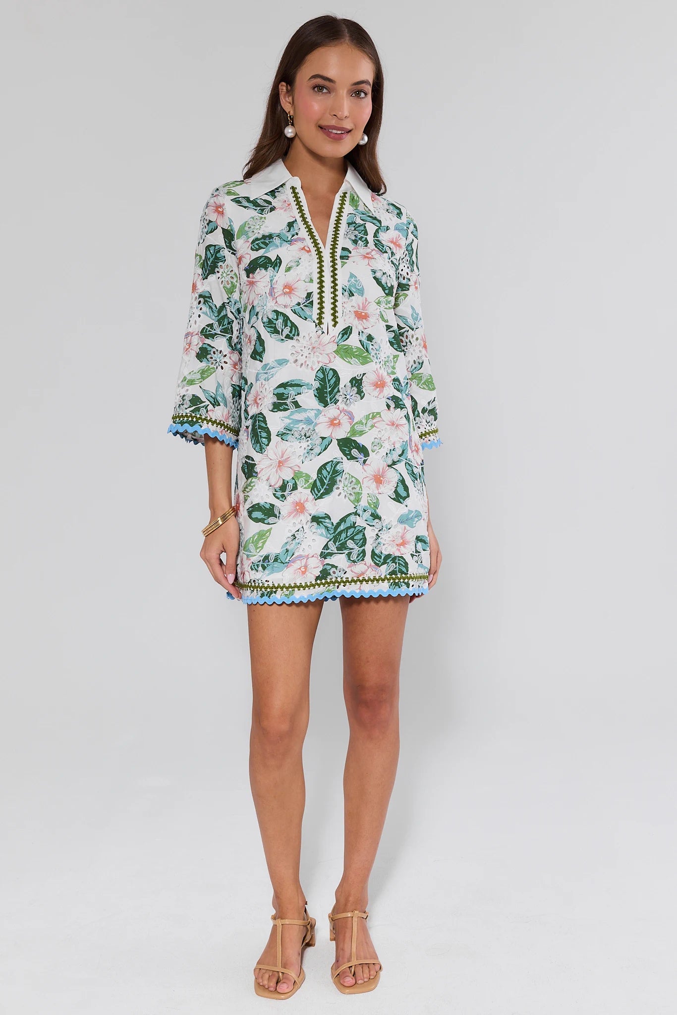 Woman wearing a floral dress with a white background