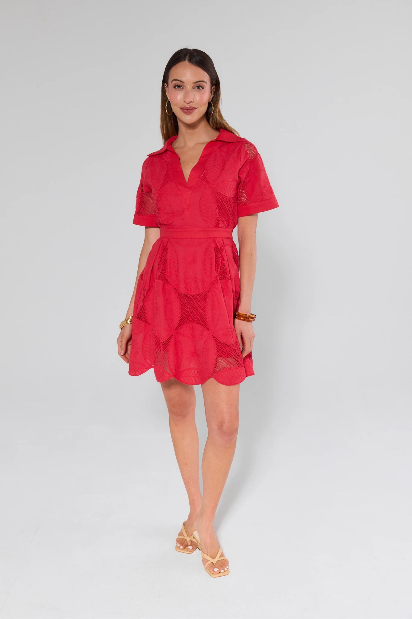 Woman wearing a red dress on a white background