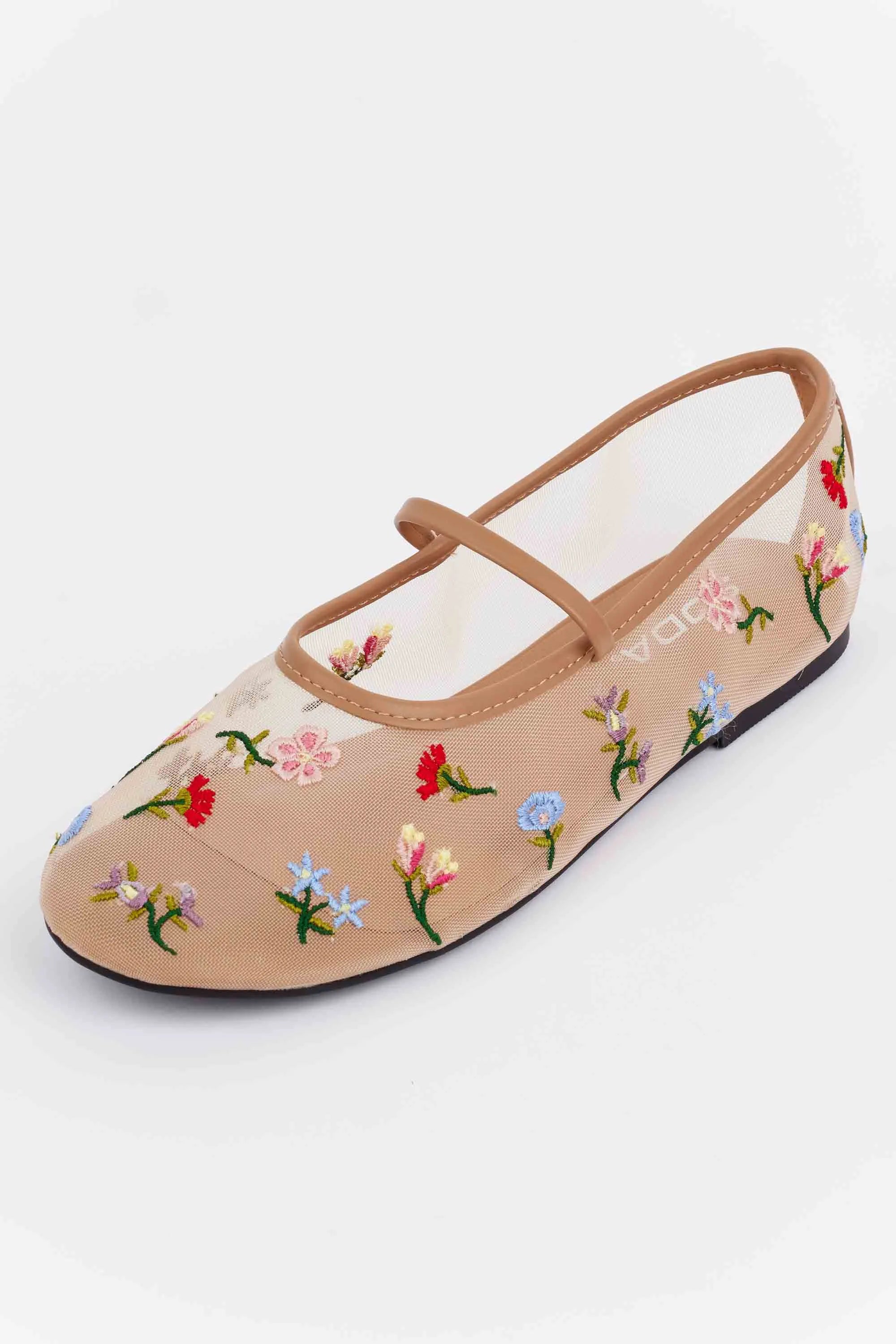 Brianna Tan Floral Mesh Flats: Sheer nude-tone Mary-Jane ballet flats with colorful floral embroidery, elastic top strap, and rubber sole, ideal for spring styling.