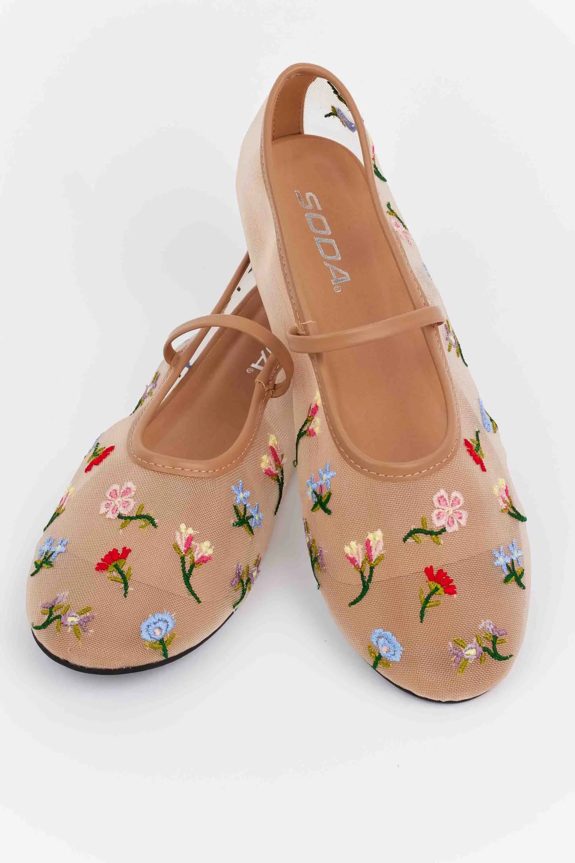 Brianna Tan Floral Mesh Flats feature nude mesh with multicolored floral embroidery, a Mary-Jane elastic strap, and a rubber sole, perfect for spring styling.
