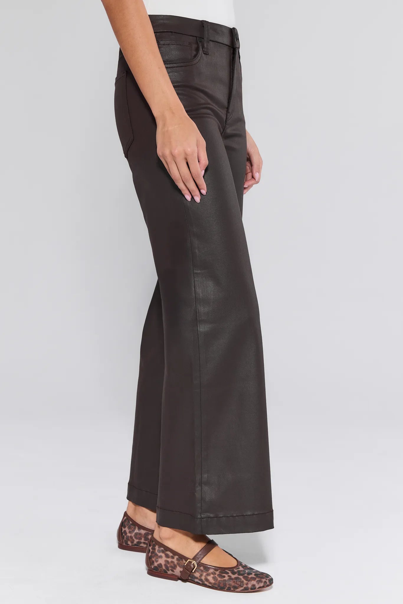 Dark brown Meg Jeans Wax Coated worn by a person on a white background