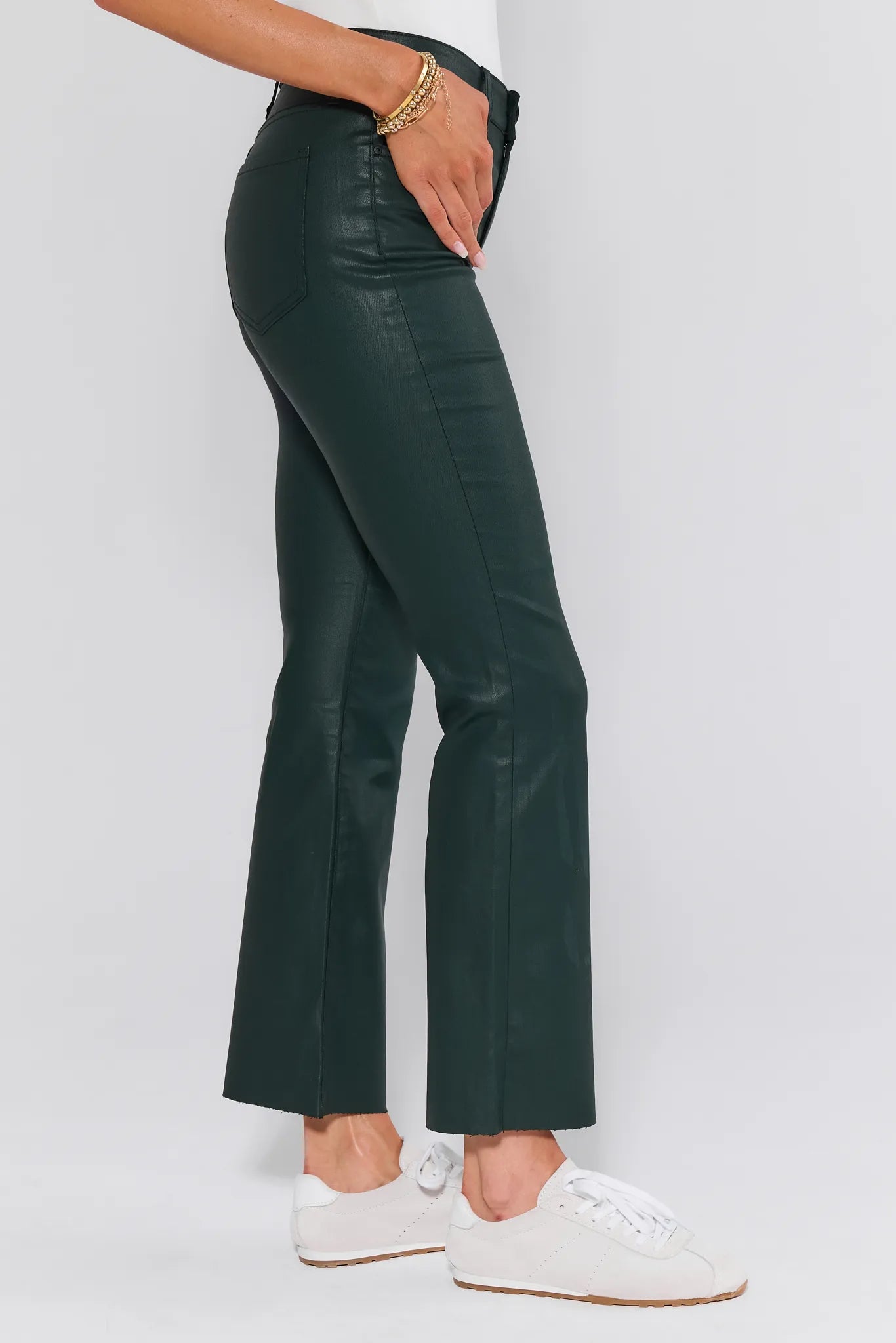 Person wearing dark green Kelsey Jeans Wax Coated with a plain white background