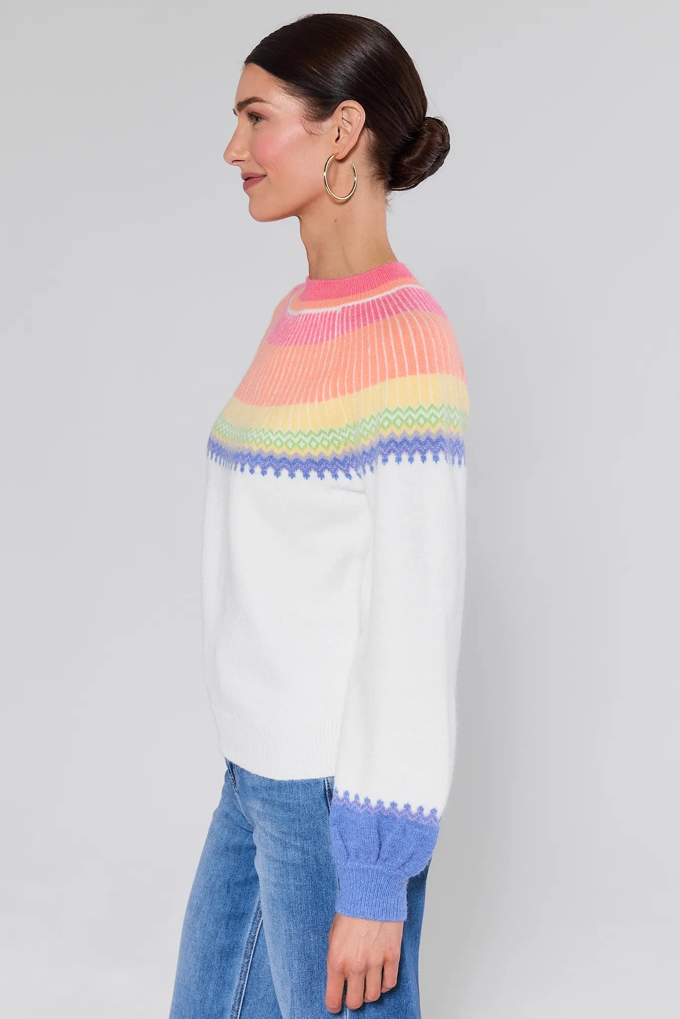 Woman wearing a Kate Multi Color Fair Isle Sweater with a plain background