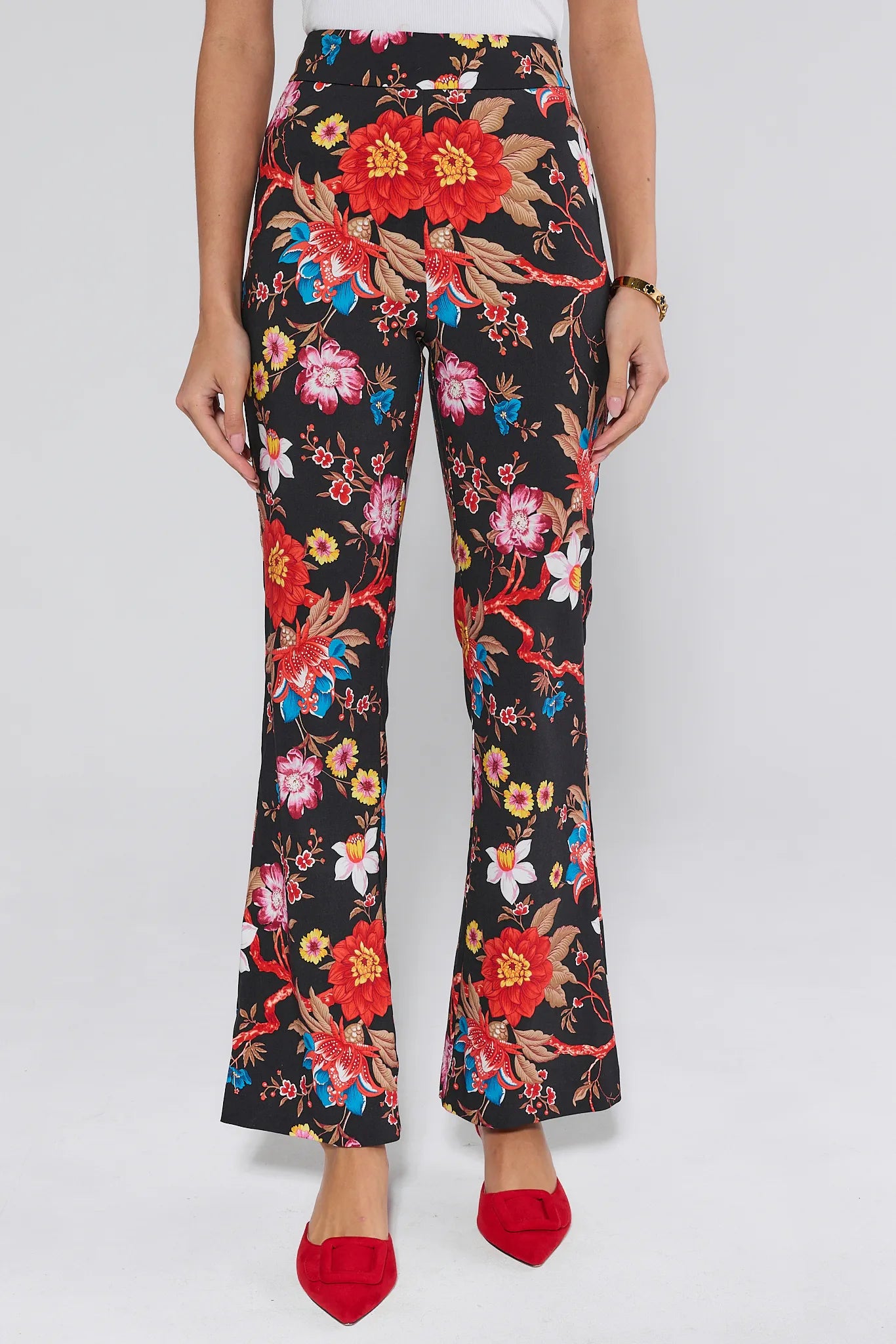 Floral patterned Annie pants worn by a person on a white background