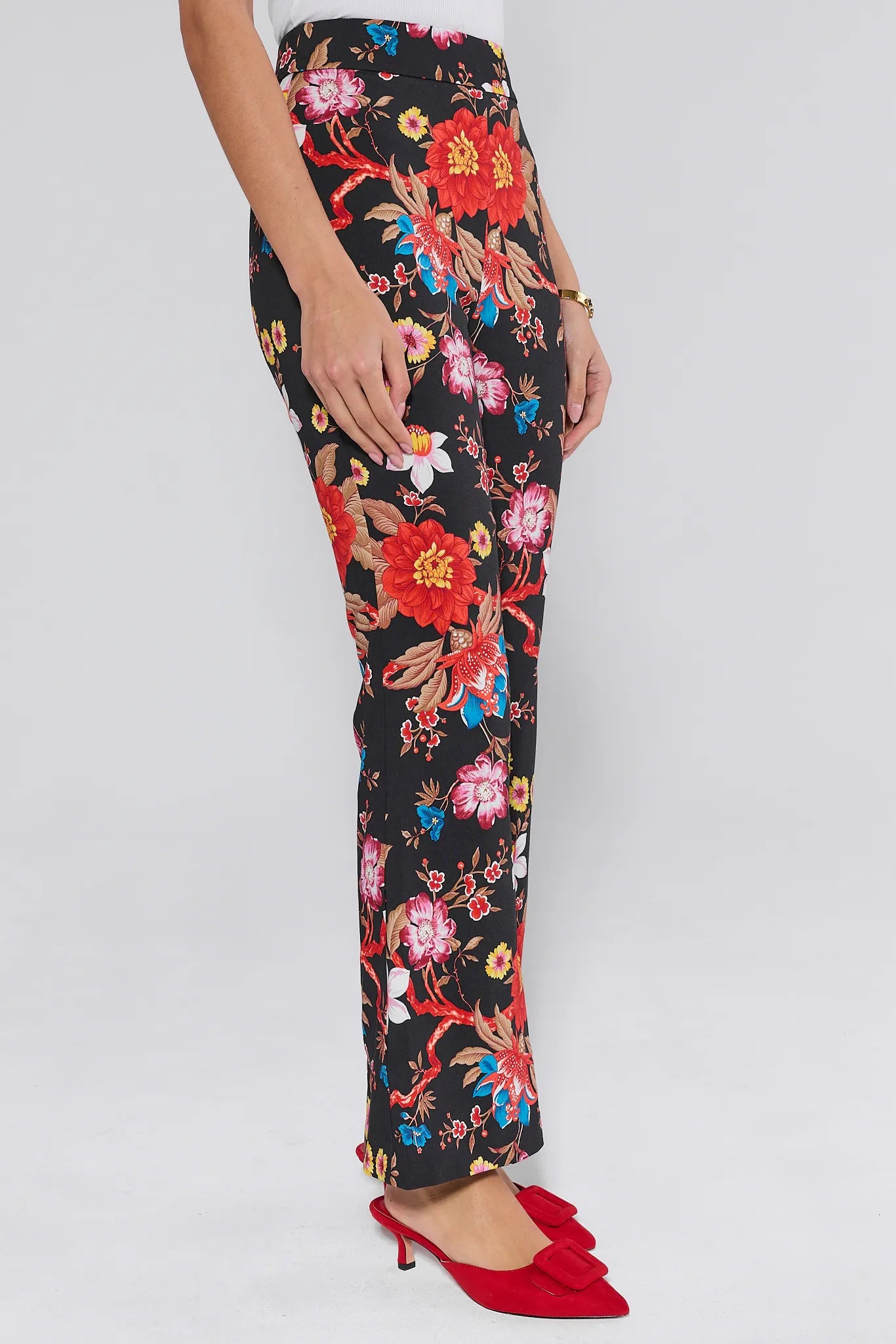 Floral patterned Annie pants worn by a person on a white background