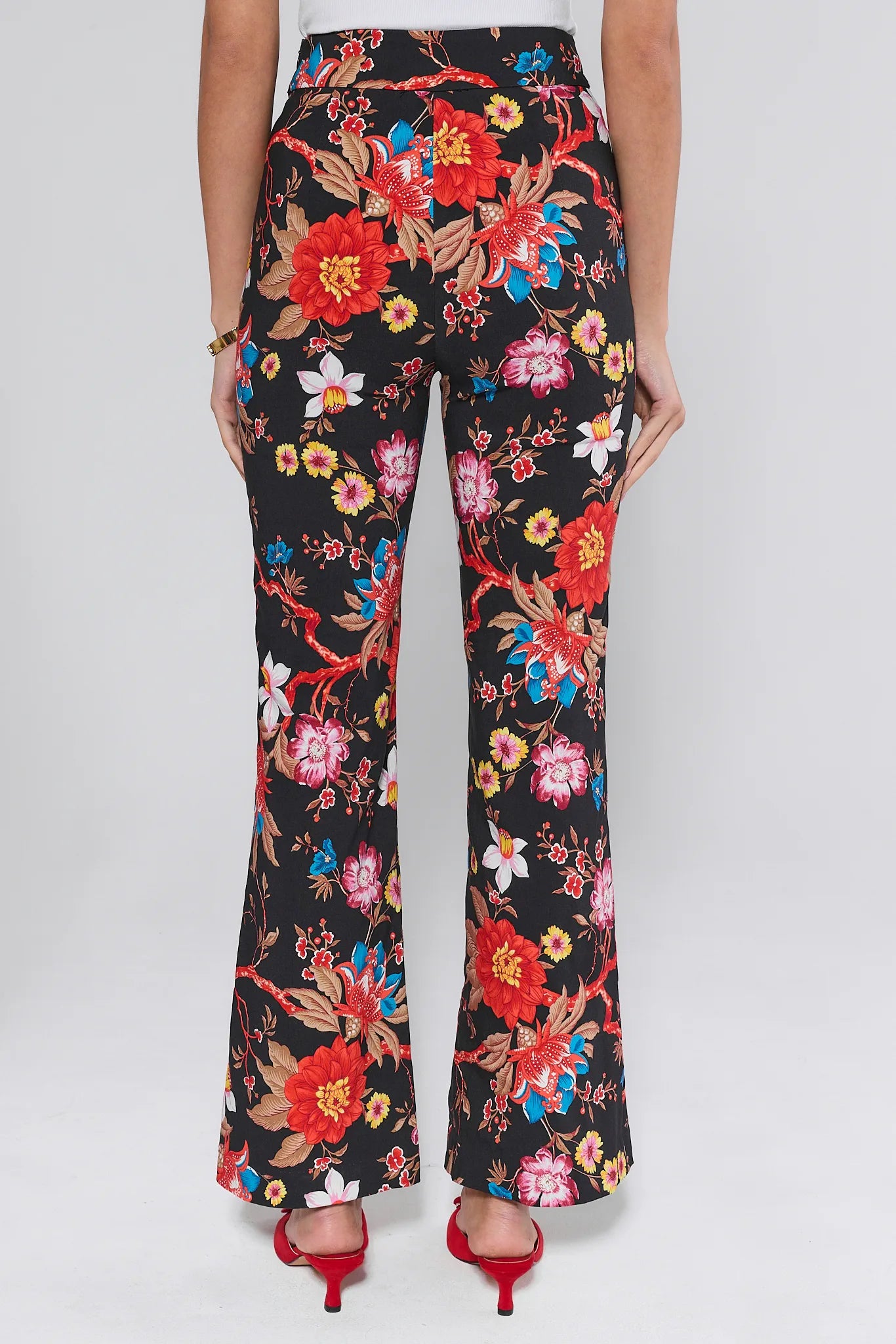 Floral patterned Annie pants worn by a person on a white background