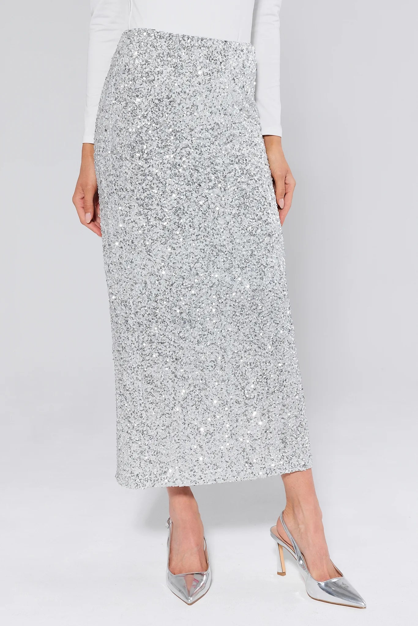 Stella Silver Sequin Maxi Skirt worn by a person on a plain background