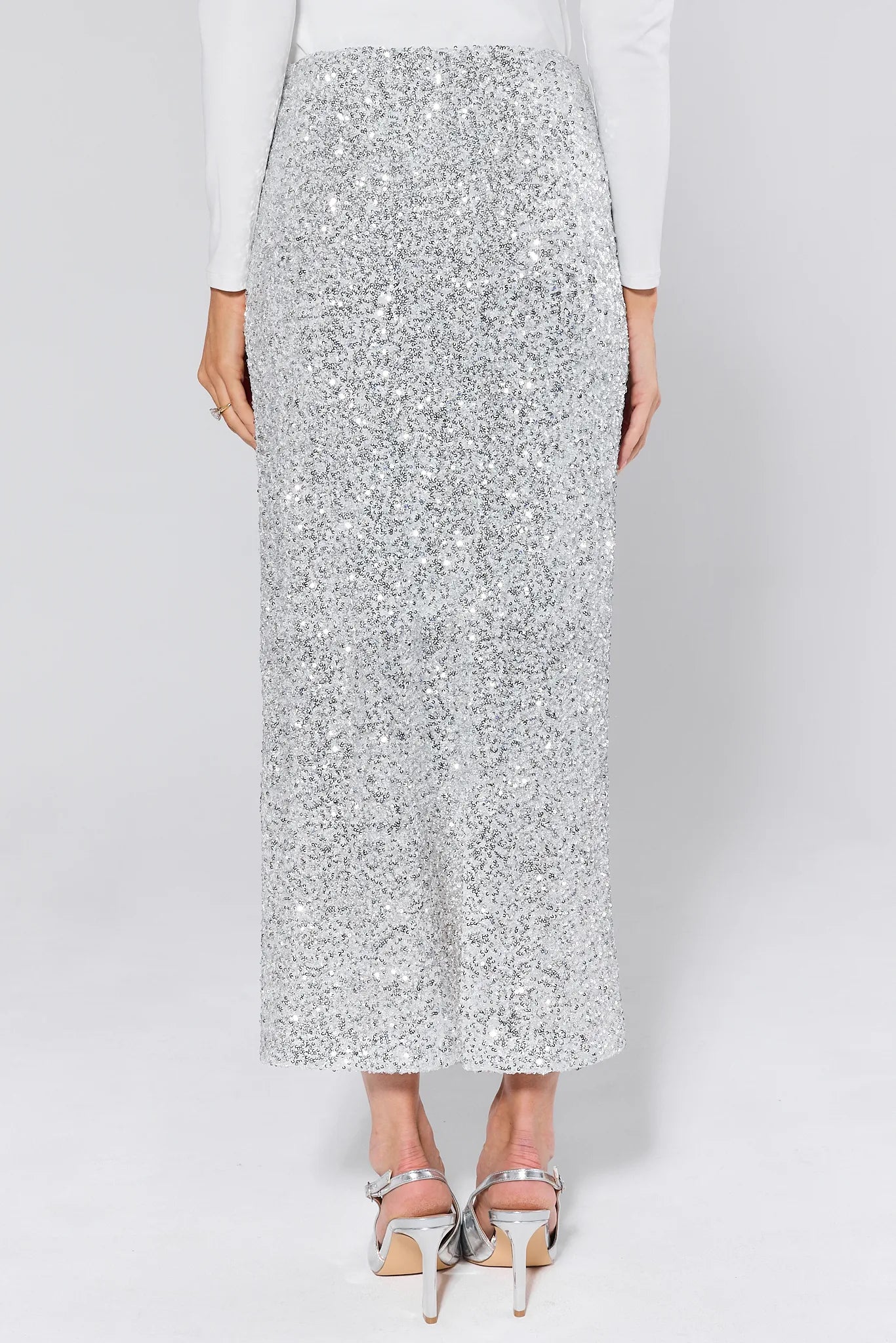 Stella Silver Sequin Maxi Skirt worn by a person on a plain background