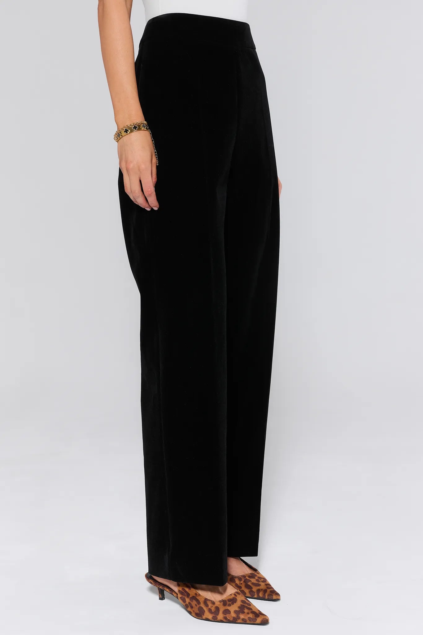 Black evie pants worn by a person on a white background