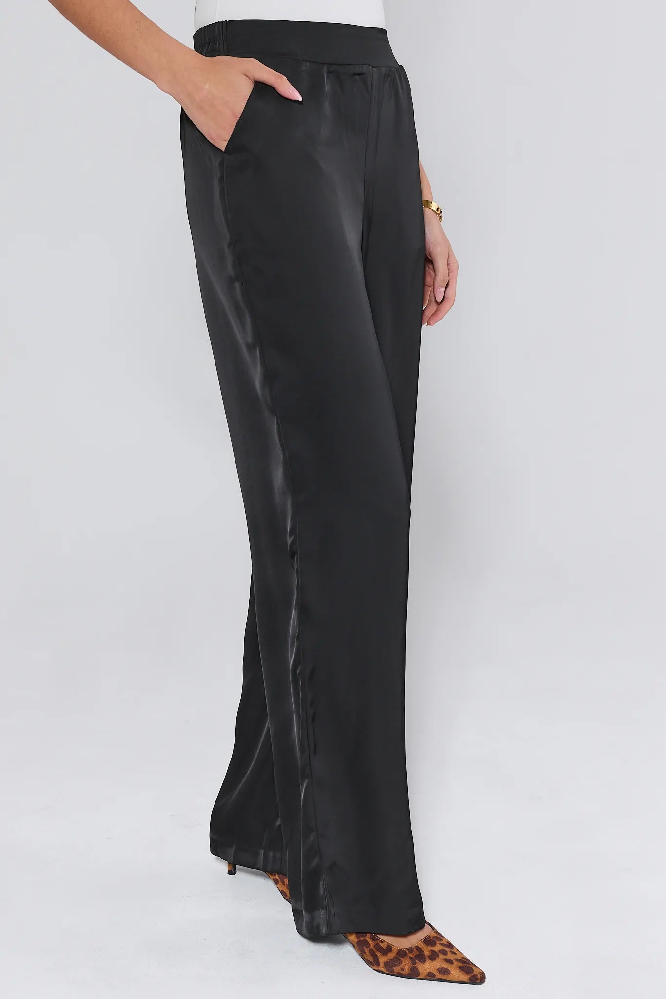 Emerson Wide Leg Trousers worn by a person on a white background