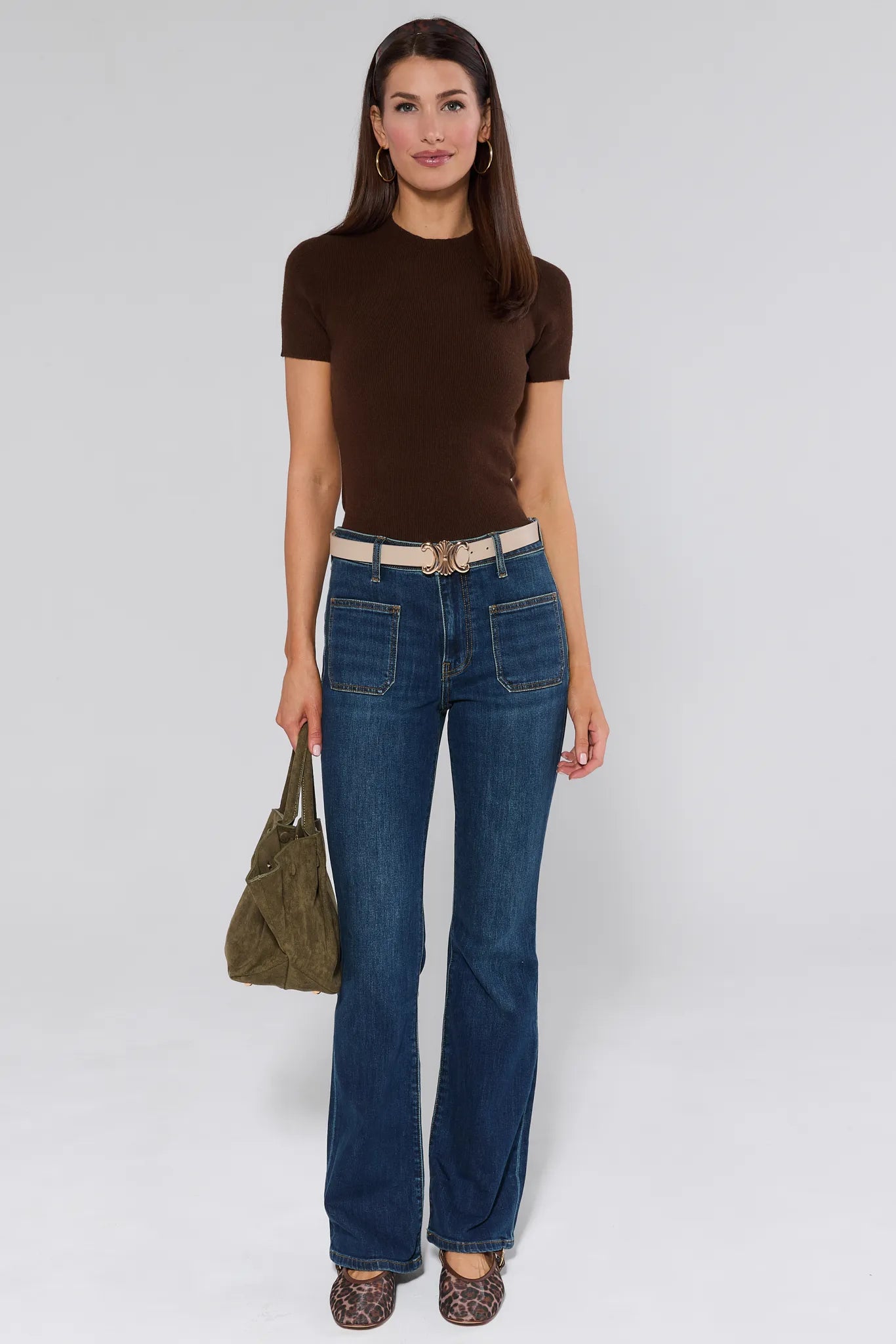 Ana Dark Wash Flare Jeans worn by a woman on a white background