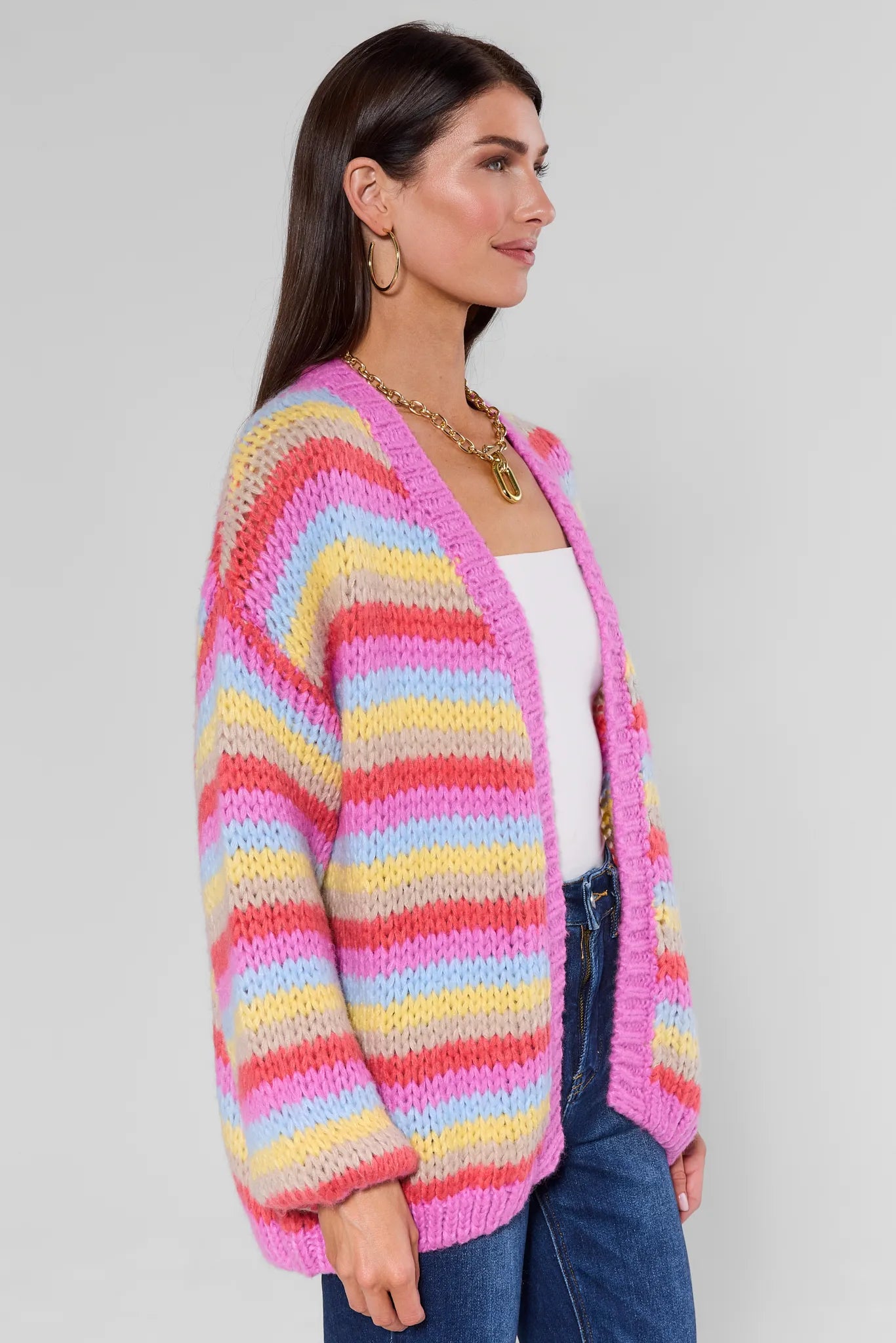 Woman wearing a Adrienne Multi Striped Knit Cardigan on a plain background