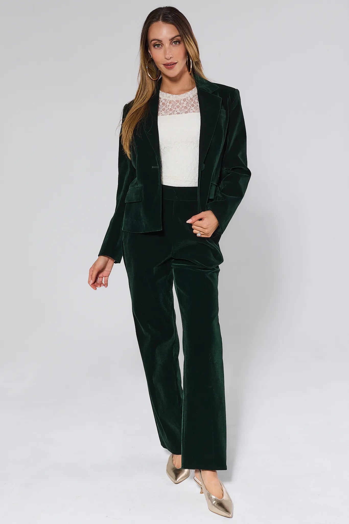 Green Evie Green Velvet Pants worn by a person on a white background