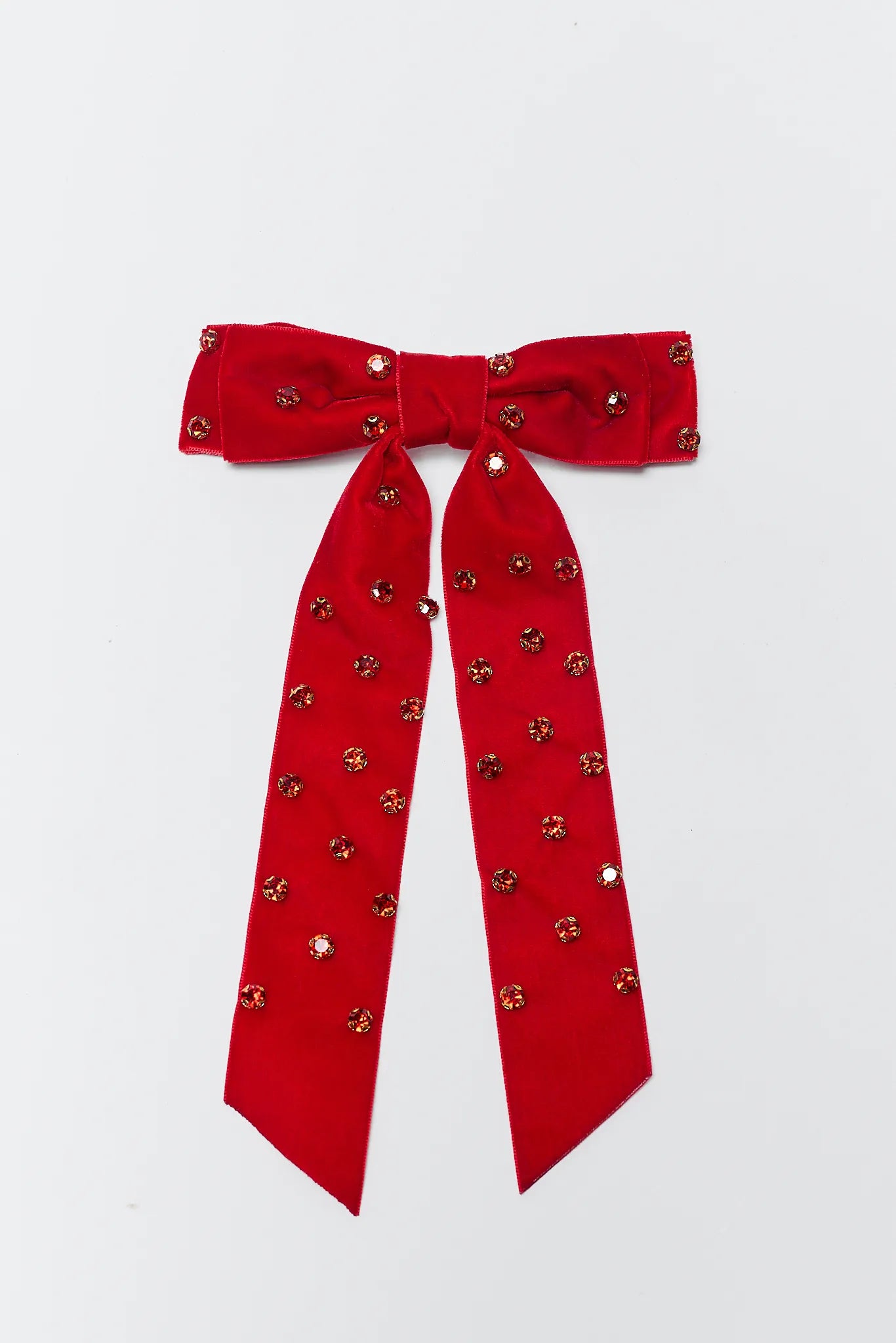 Red bow with decorative elements on a white background