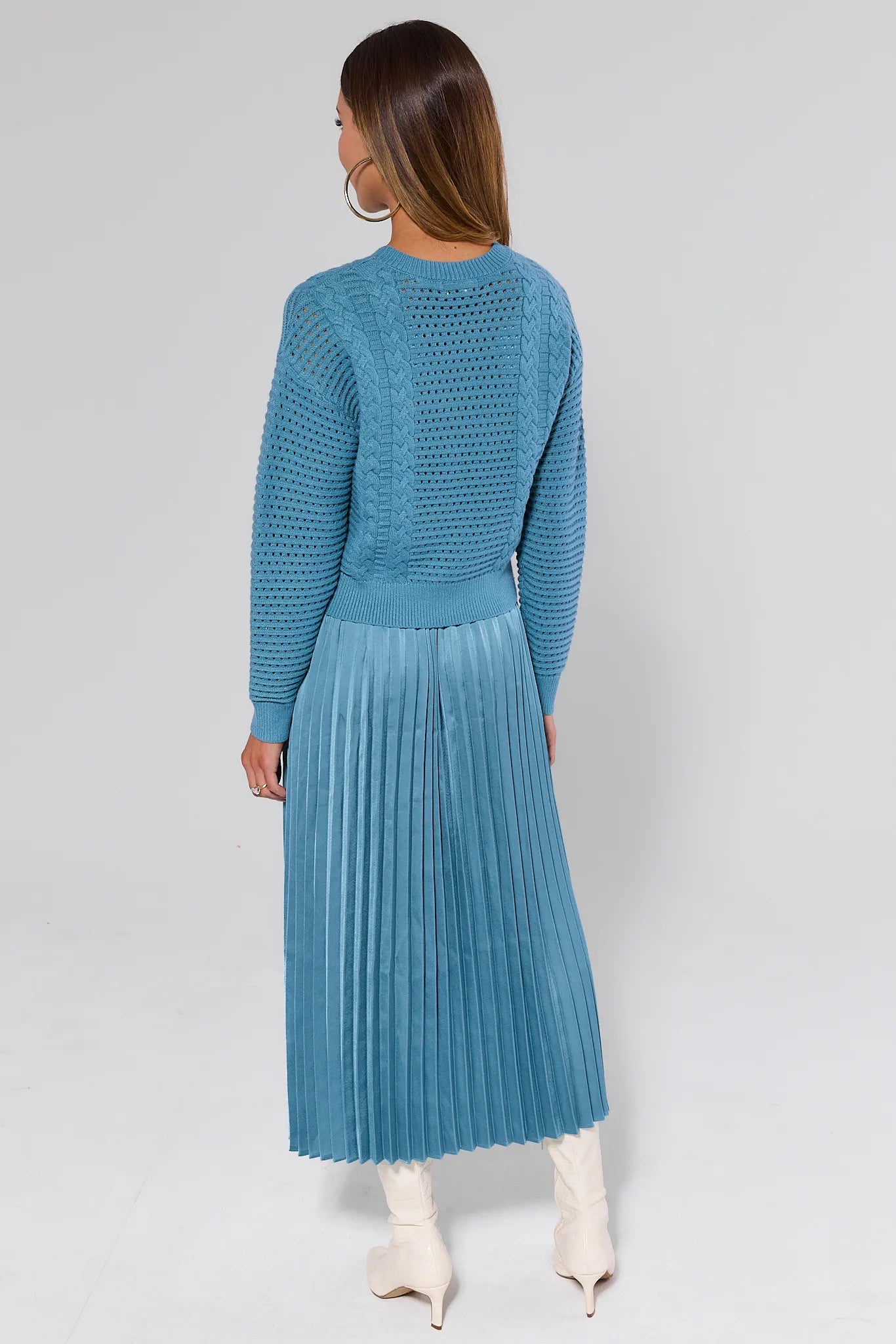 Woman wearing a Gabbie Dusty Blue Midi Dress on a white background