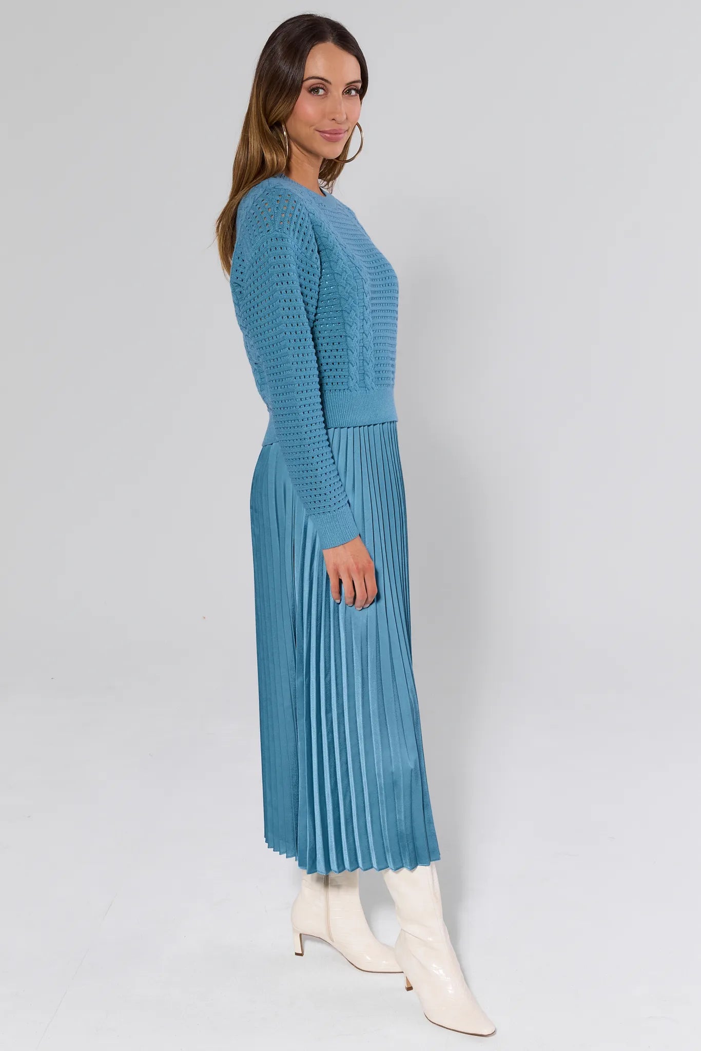 Woman wearing a Gabbie Dusty Blue Midi Dress on a white background