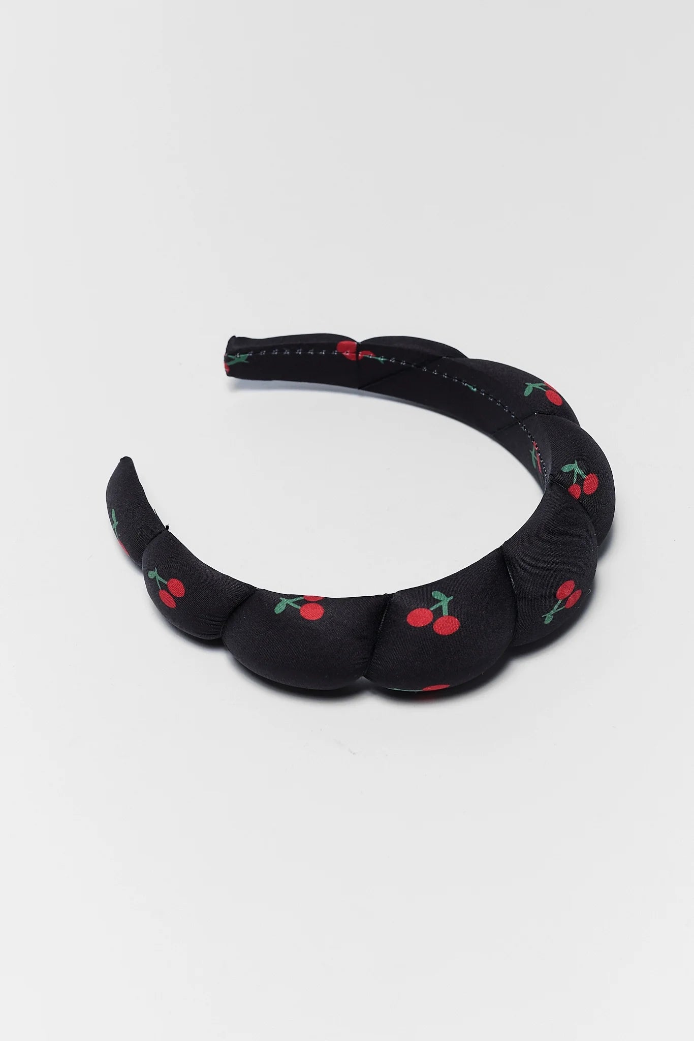 black cherry headband on white background