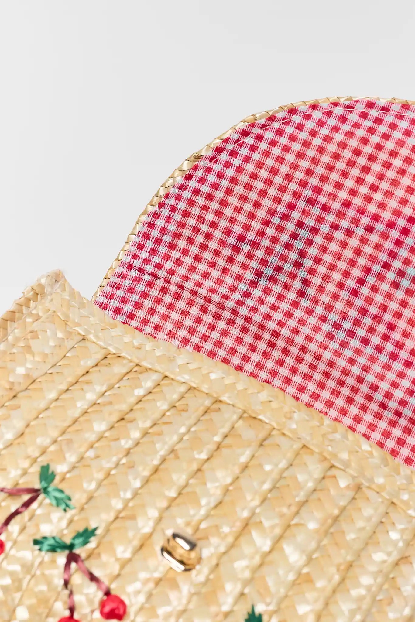 close up detail Colette Woven Raffia Cherry Clutch
