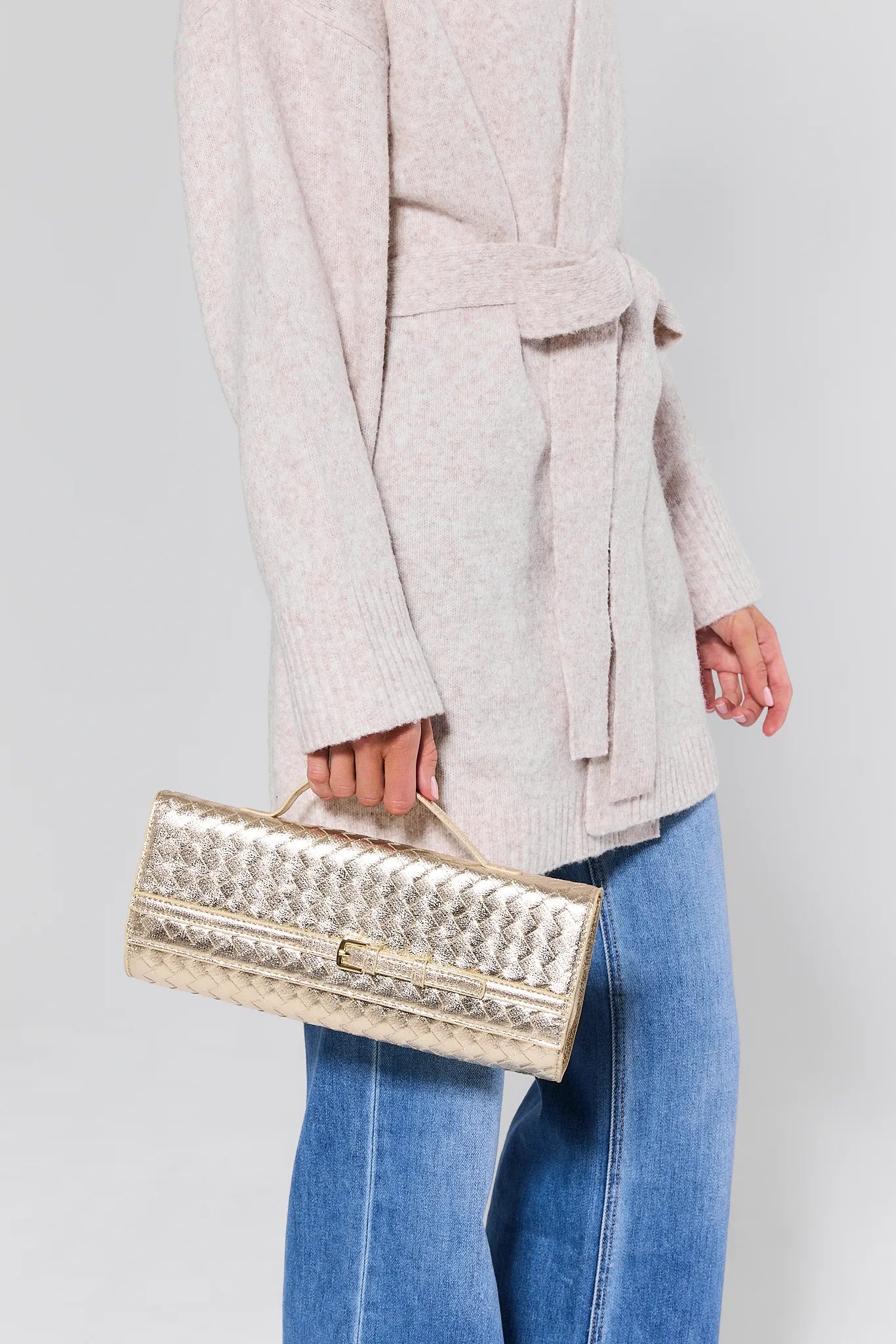 Emerson Gold Faux Leather Bag with gold accents on a light gray background