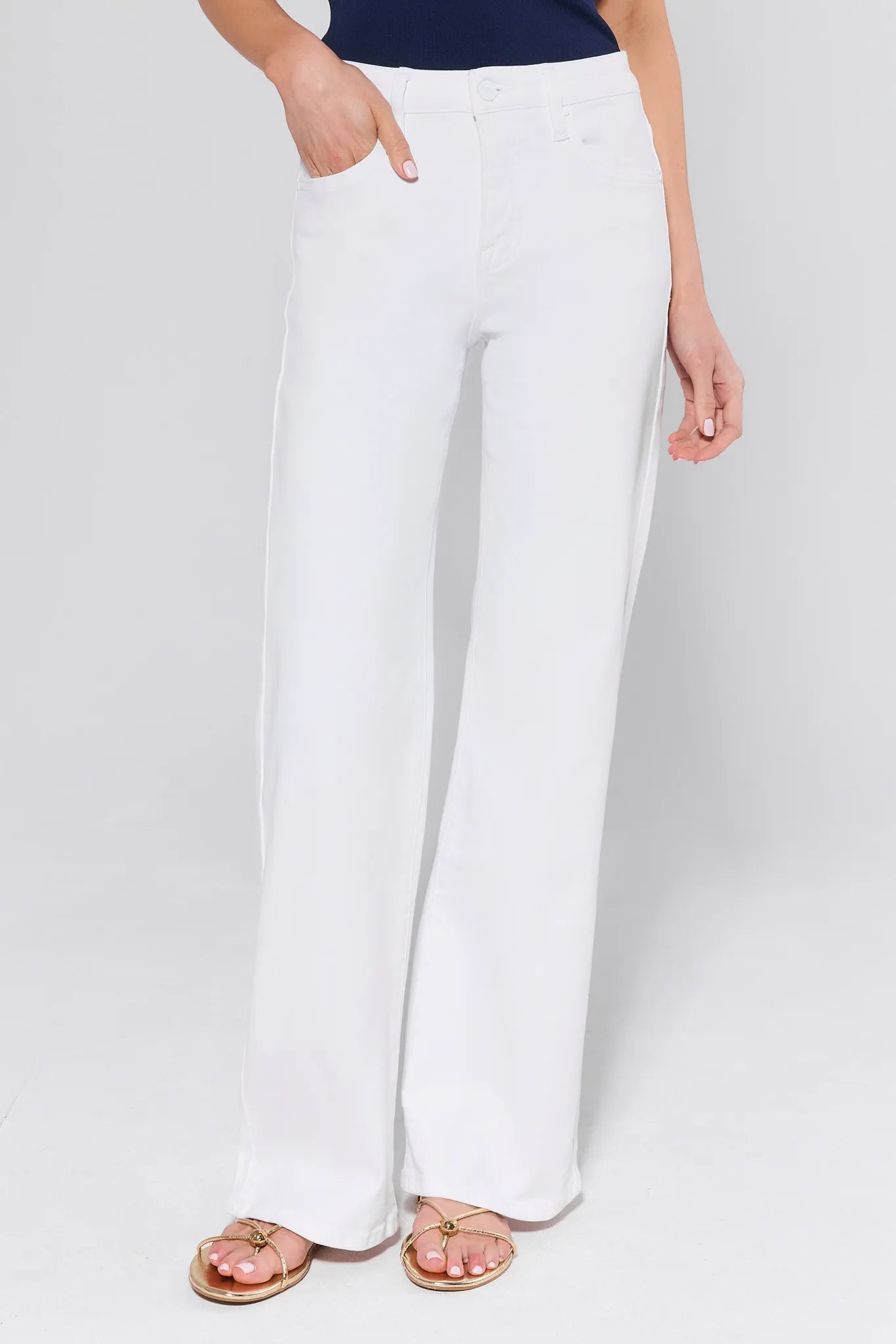 White wide-leg pants worn by a person on a white background
