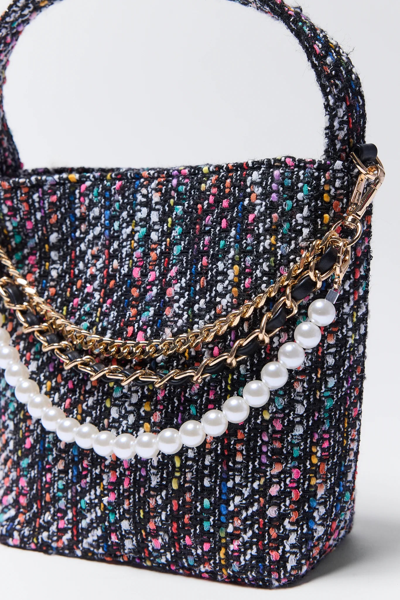 textured Chloe Black Multi Tweed Bag with pearl chain on a light gray background
