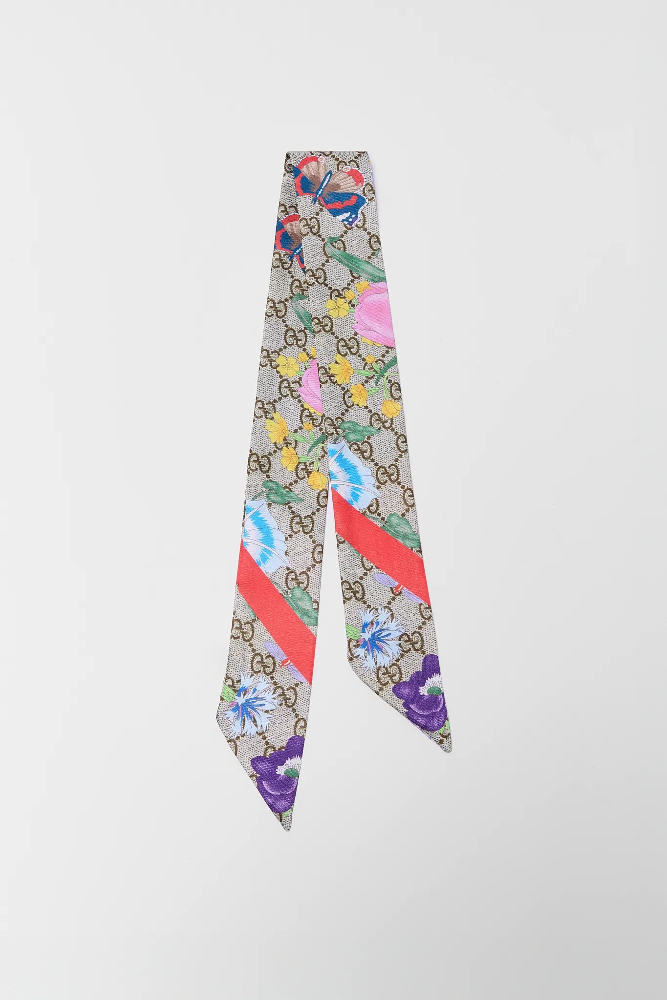 Colorful patterned scarf with a brand logo on a white background