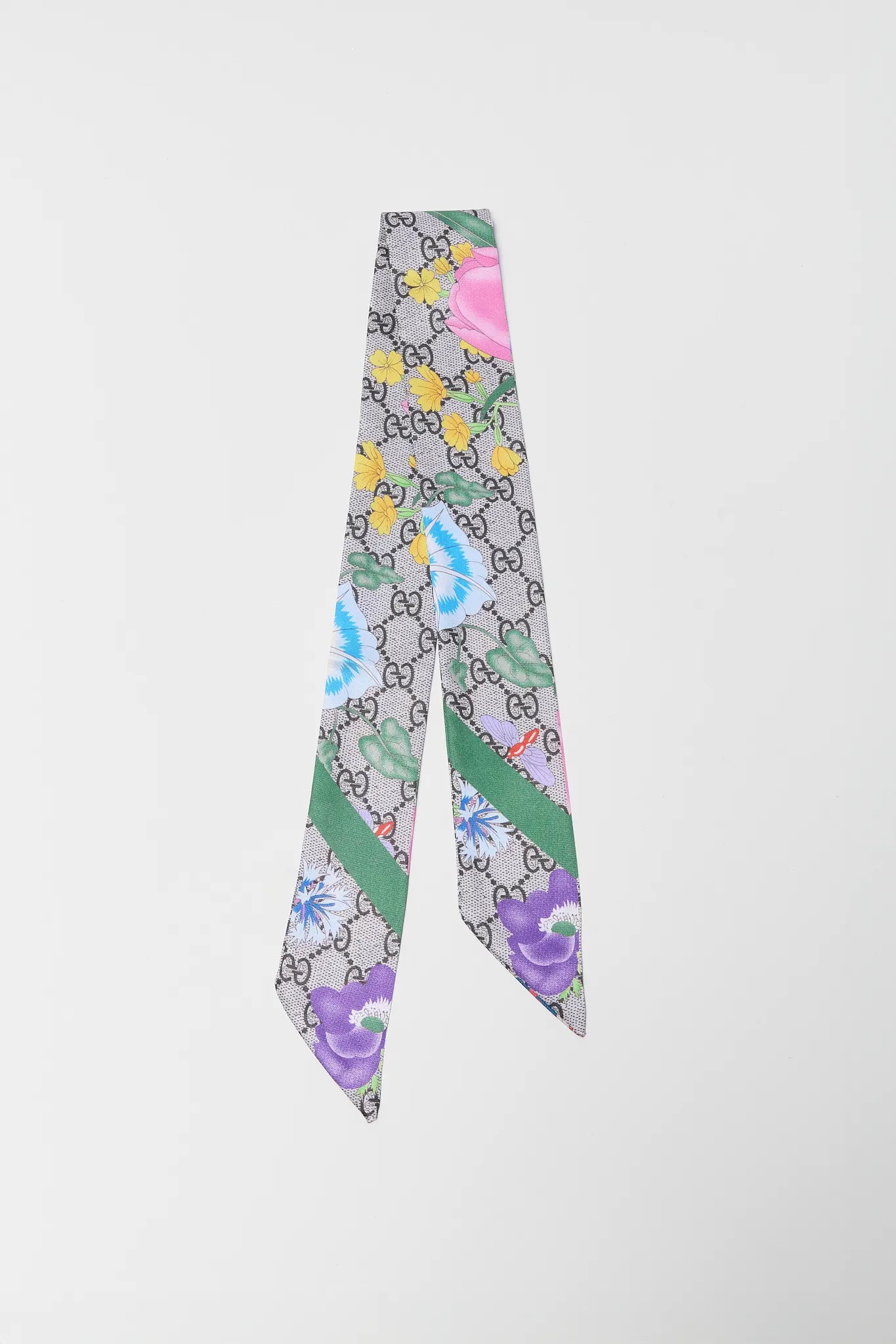 Colorful patterned scarf with brand logo on a white background