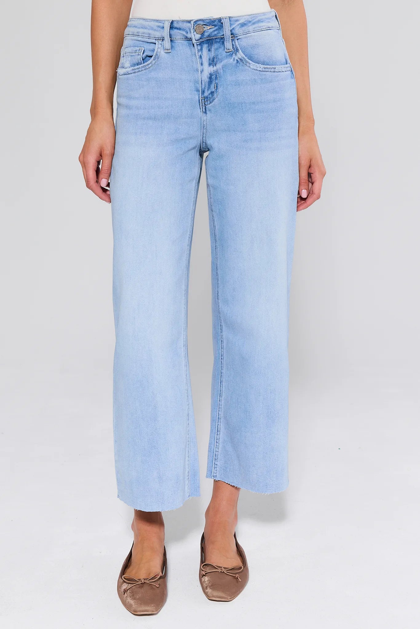 Blake Light Wash Wide Leg Jeans worn by a person on a white background