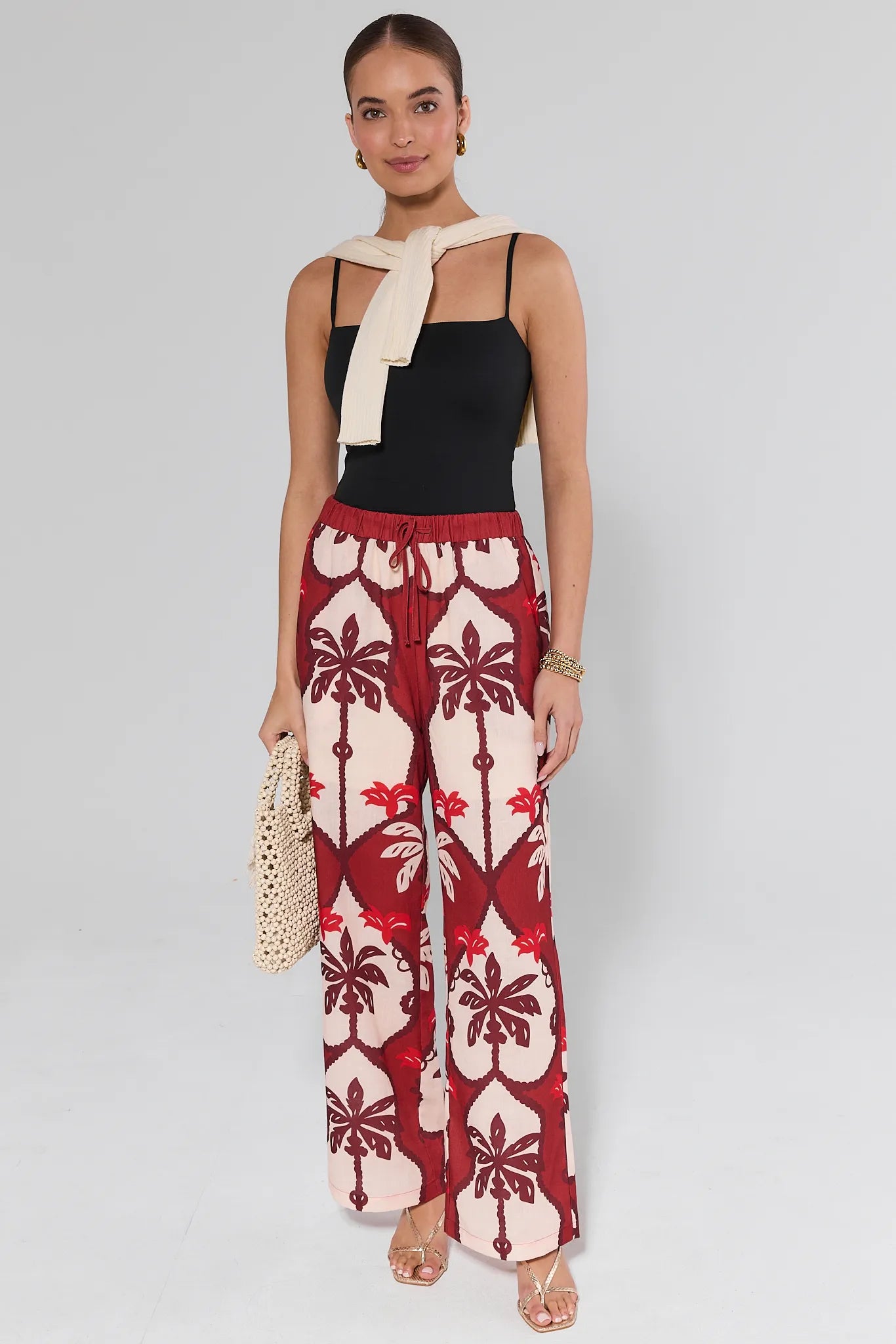 Celine Maroon Printed Pants worn by a person on a plain background