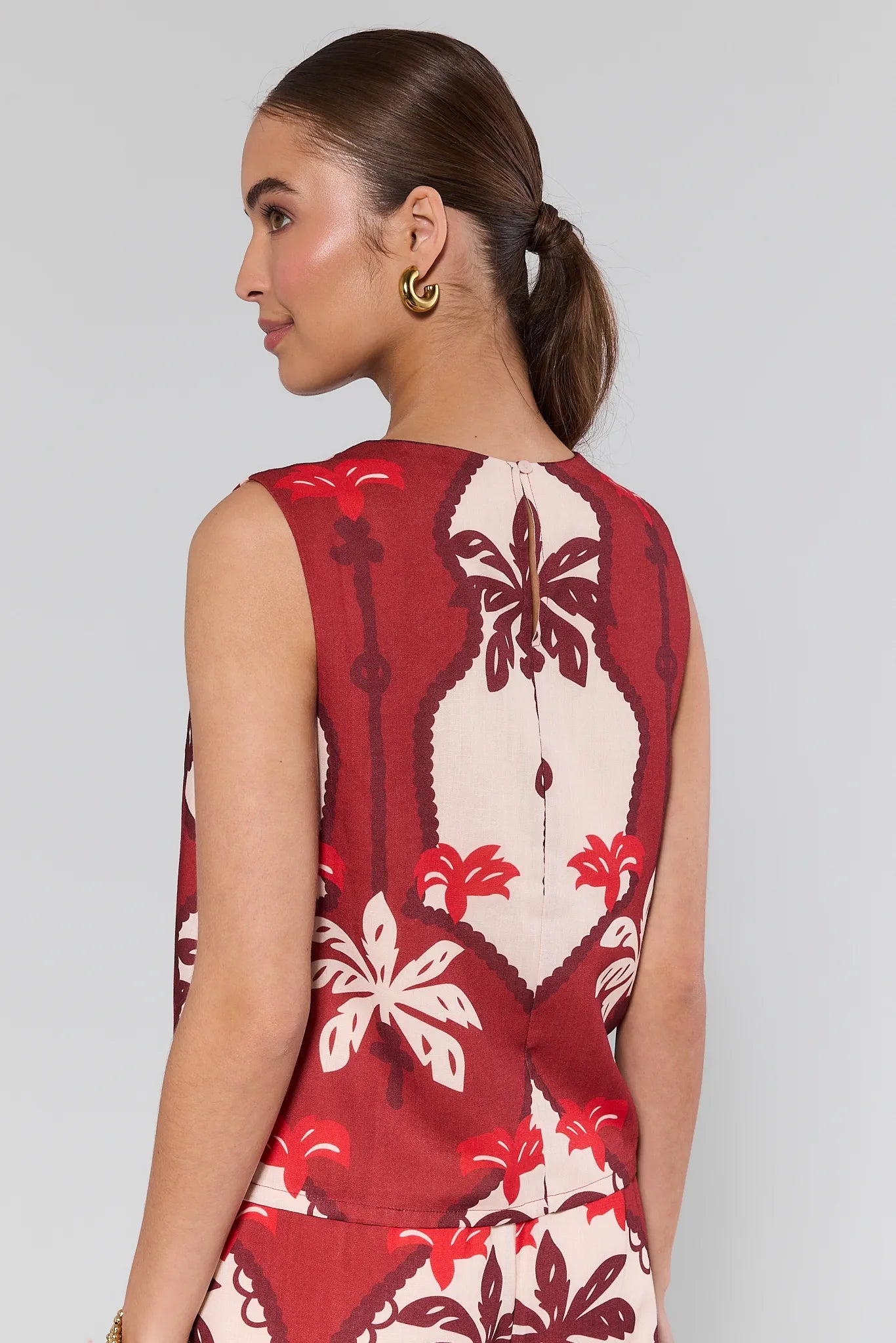 Woman wearing a Celine Maroon Printed Tank Top against a plain background