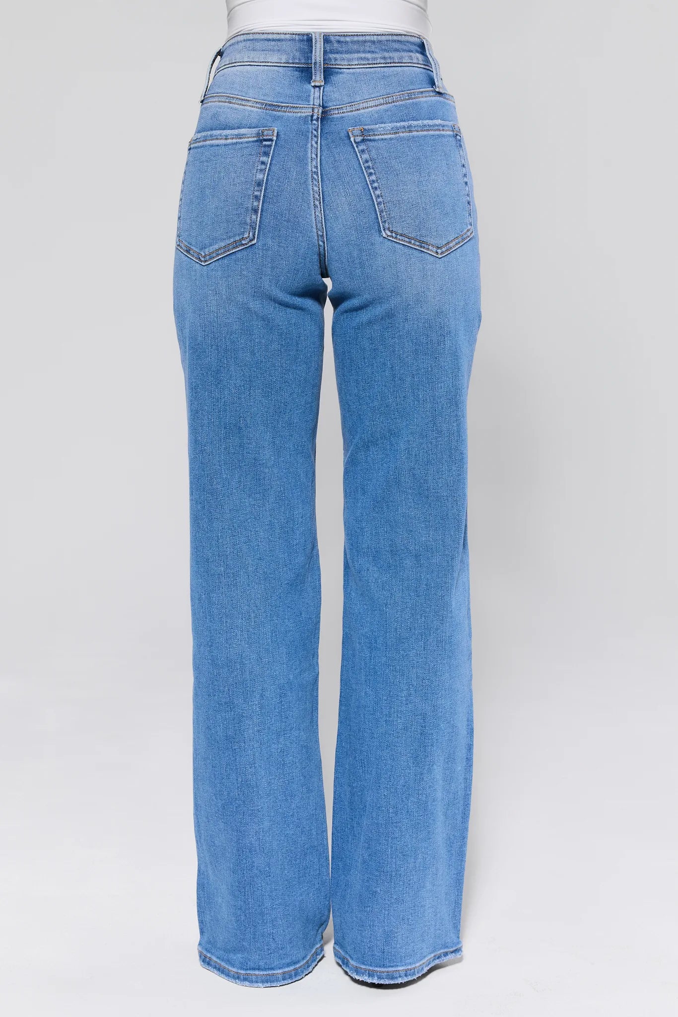 Brighton Medium Wash Straight Leg Jeans worn by a person on a white background