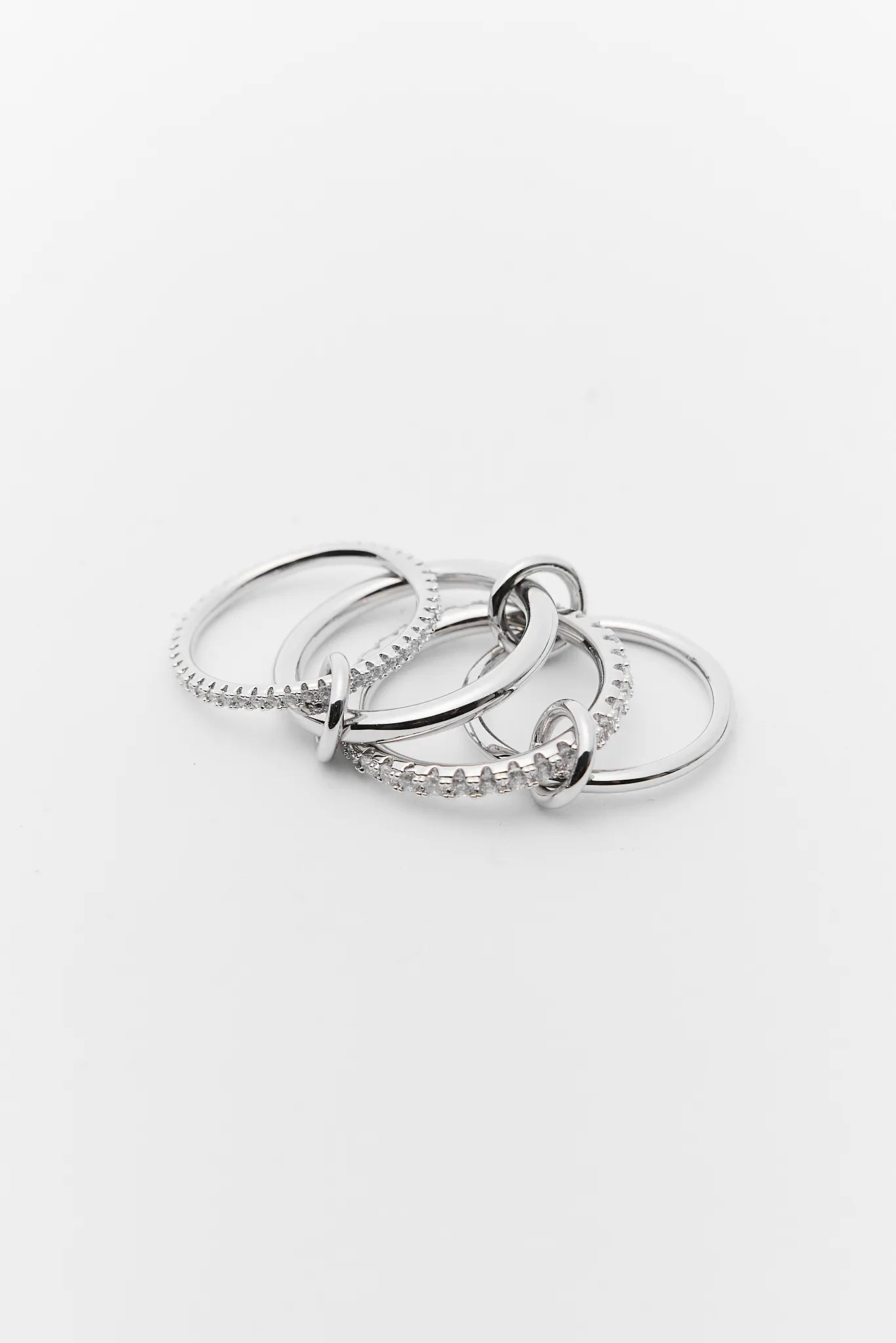 Three silver rings stacked on a white background