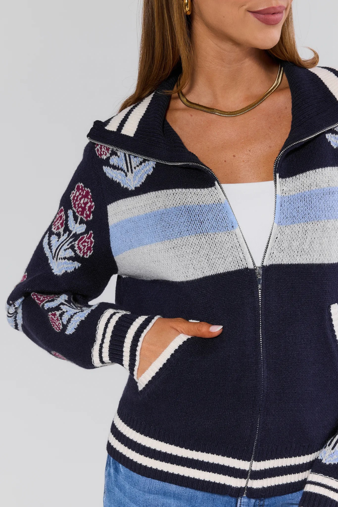 Corrine Floral Zip Up Cardigan navy blue with floral patterns on a plain background