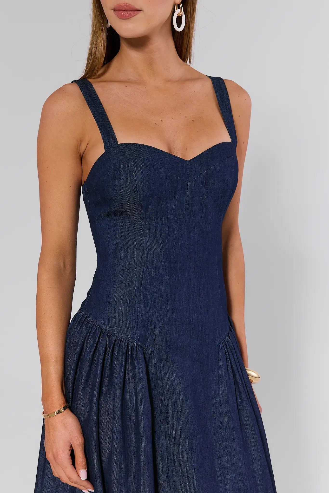 Navy blue dress worn by a model on a plain background