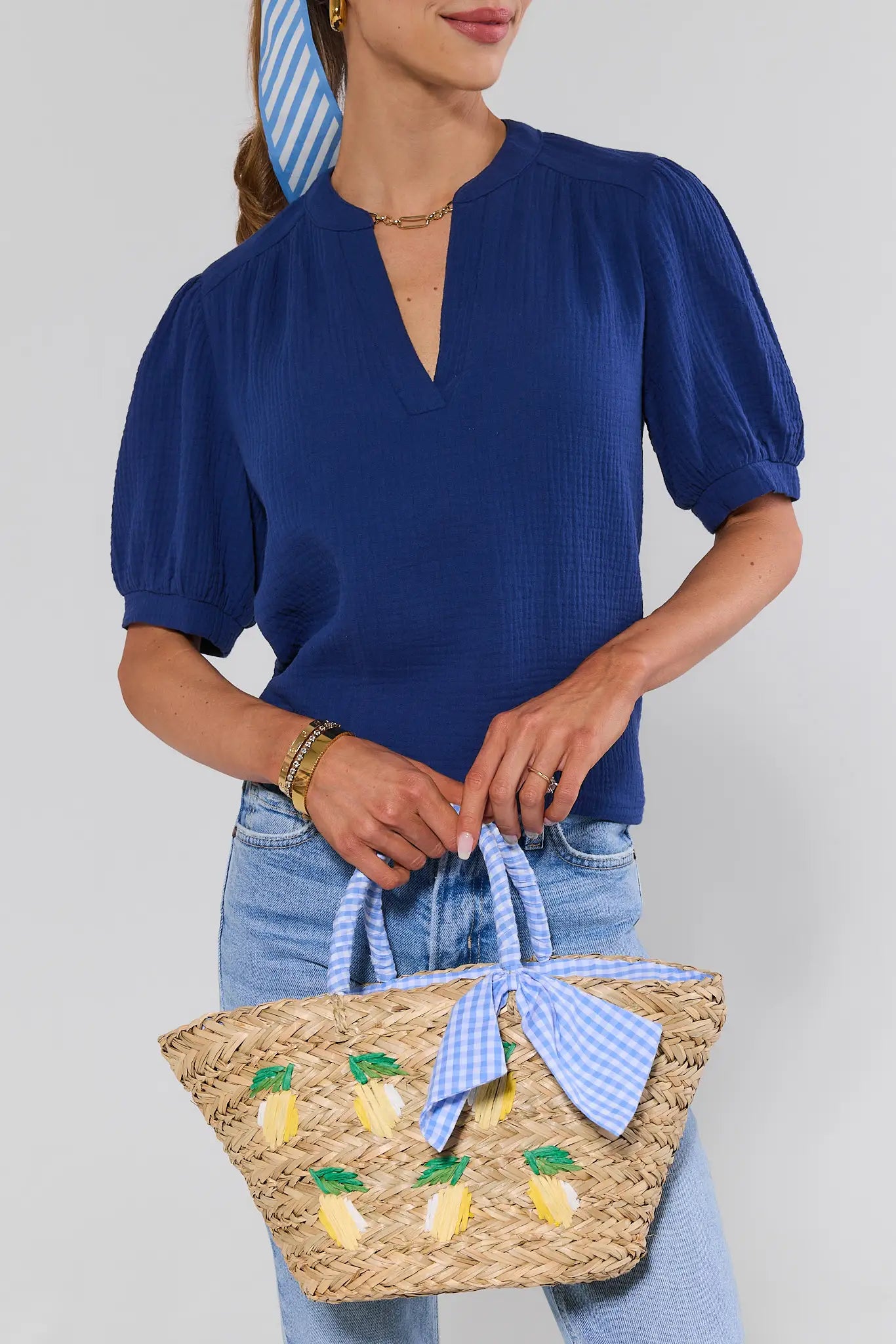 woman wearing Gentry Woven Raffia Lemon Bag