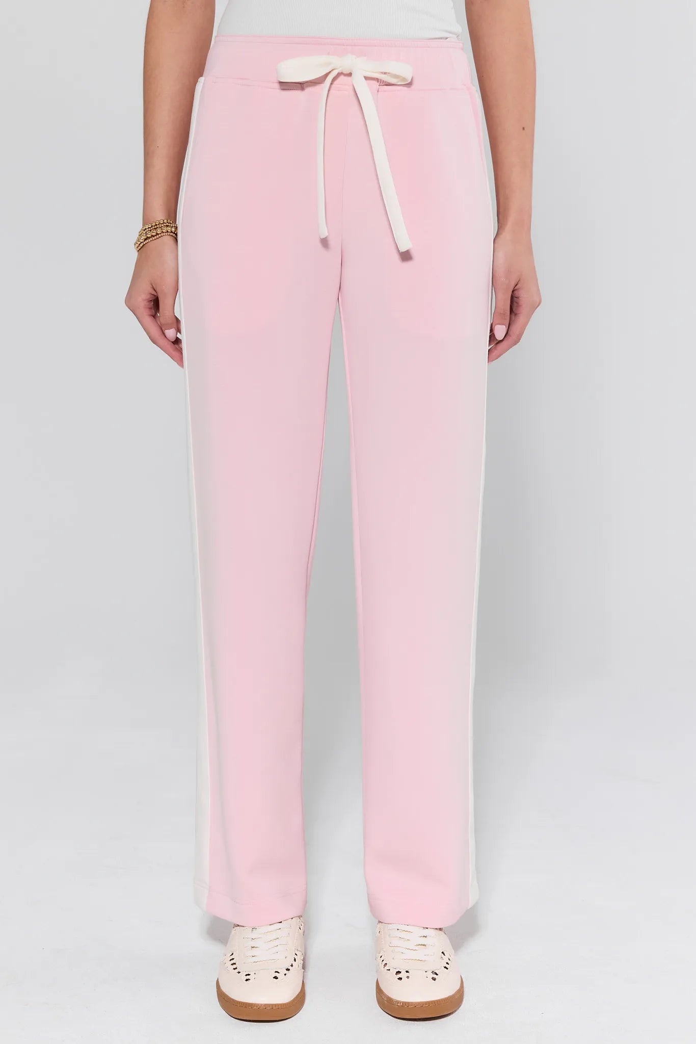 Pink pants with a drawstring on a white background