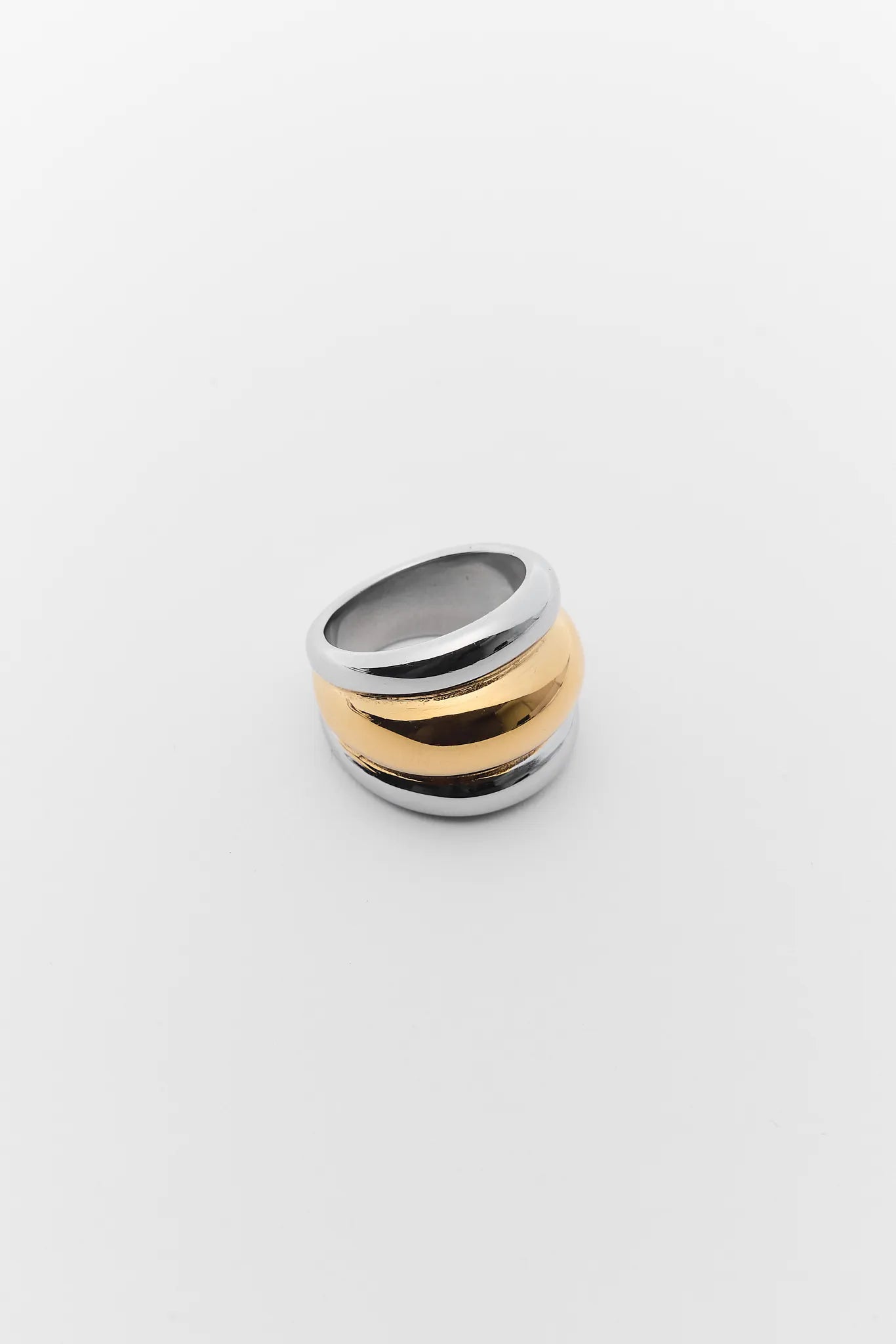 Three-band ring with black, gold, and silver colors on a white background Daley Two Tone Fluted Ring