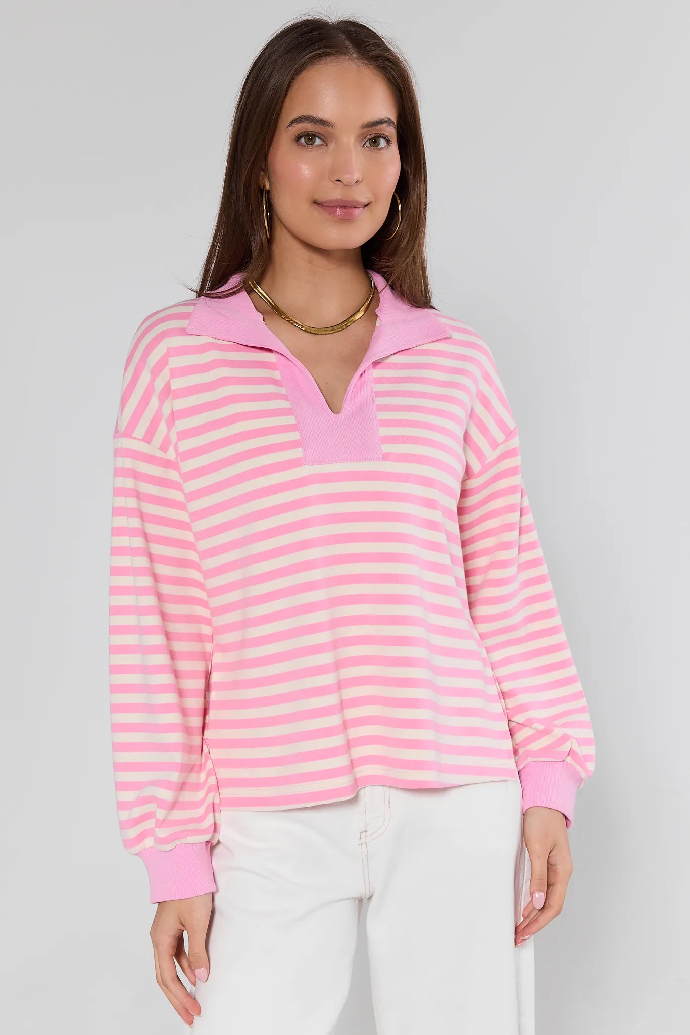 pink top with stripes on model with white background