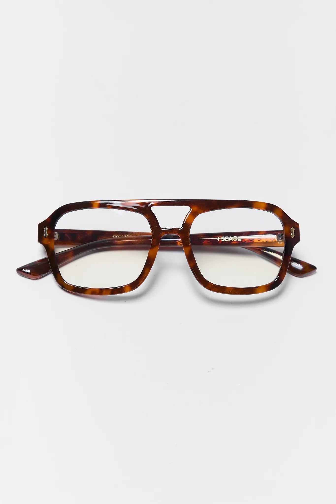 tortoise blue light glasses on white background