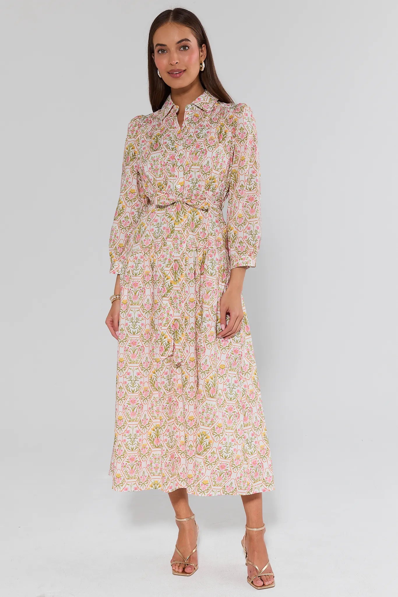 Woman wearing a floral dress on a white background