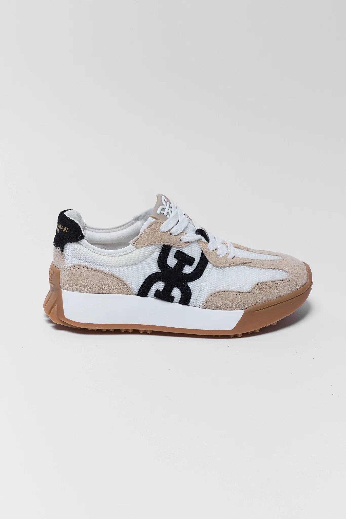 Sneaker with a black design on a light gray background