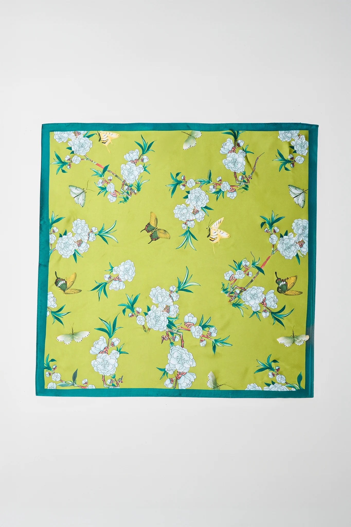 Floral patterned fabric square on a white background