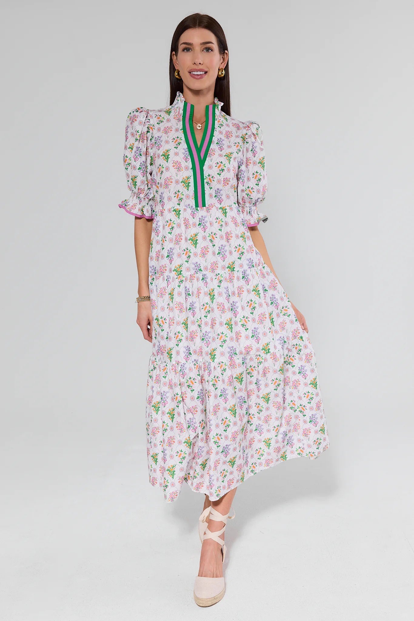 Woman wearing a floral dress with a white background