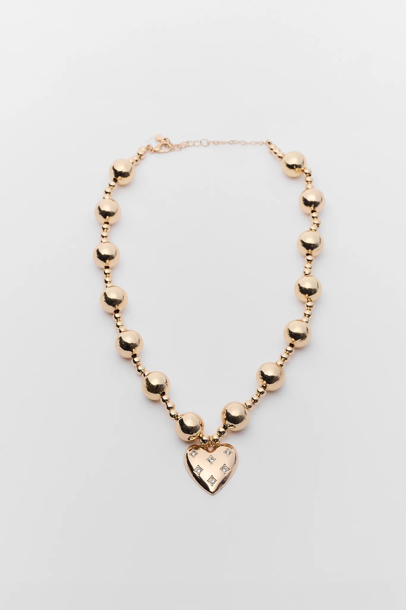 Madeline Gold Beaded Heart Necklace on white background