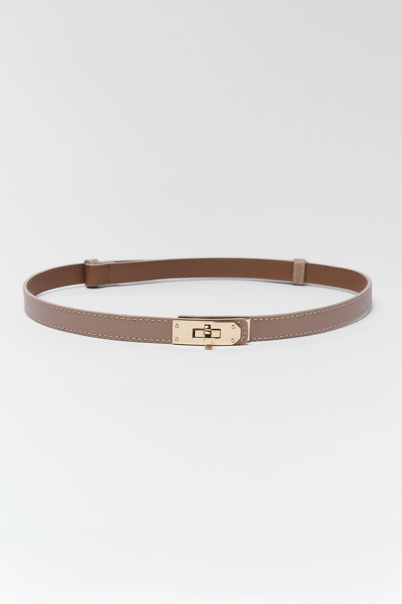 Brown belt with a gold buckle on a white background