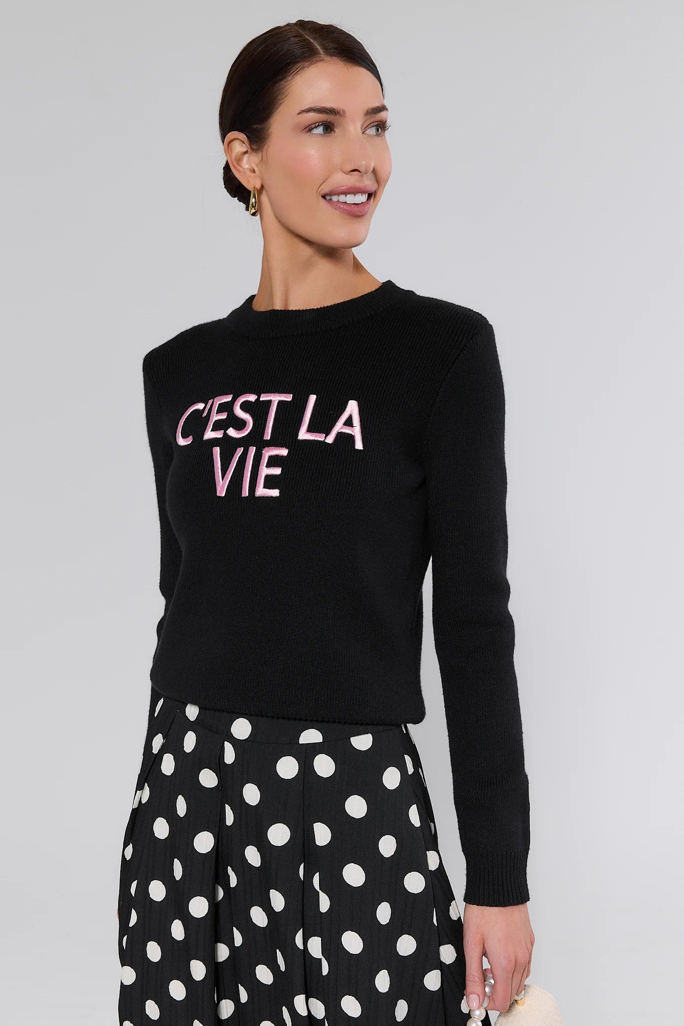 woman wearing black sweater on white background