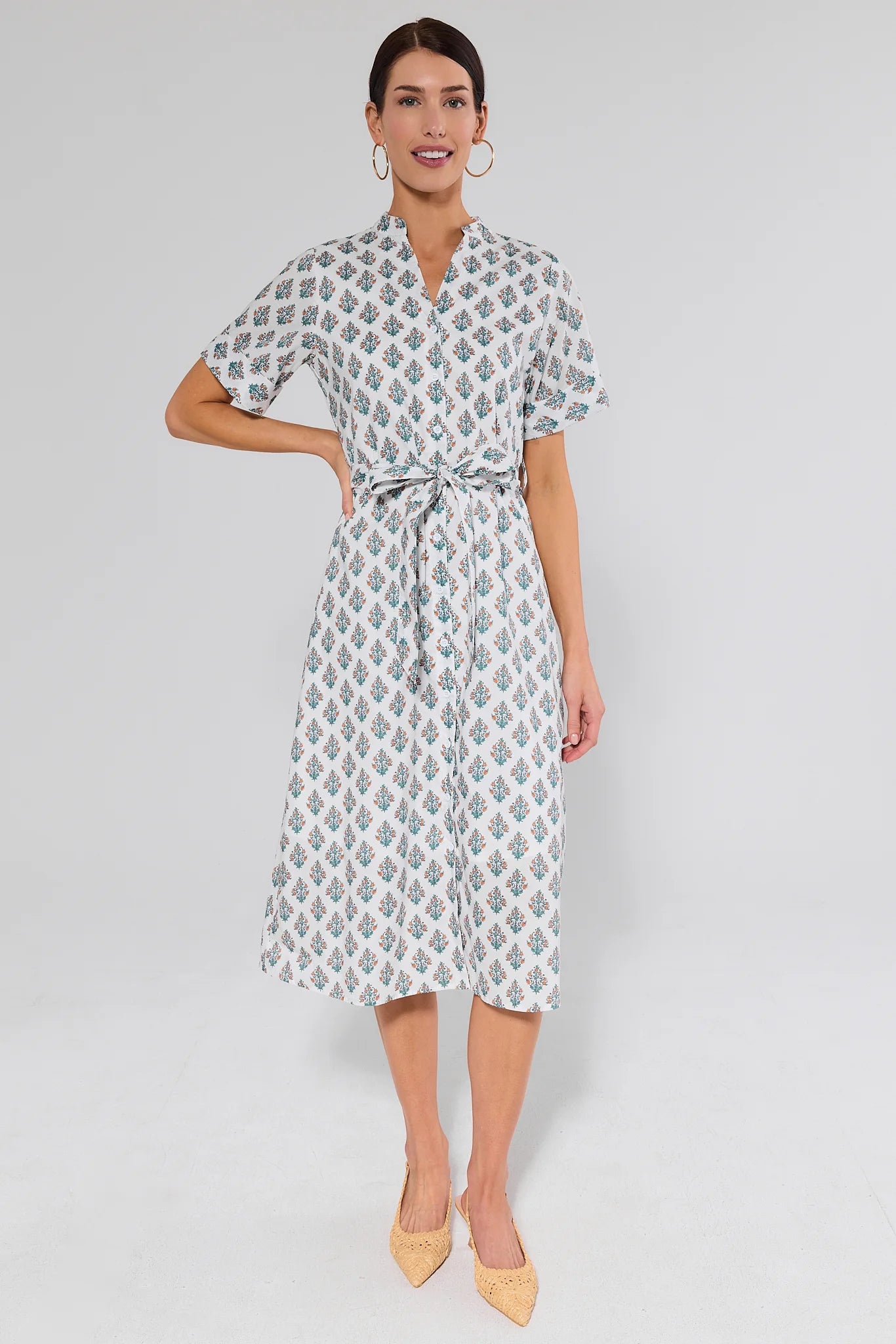 full body woman wearing white dress with floral block print on white background