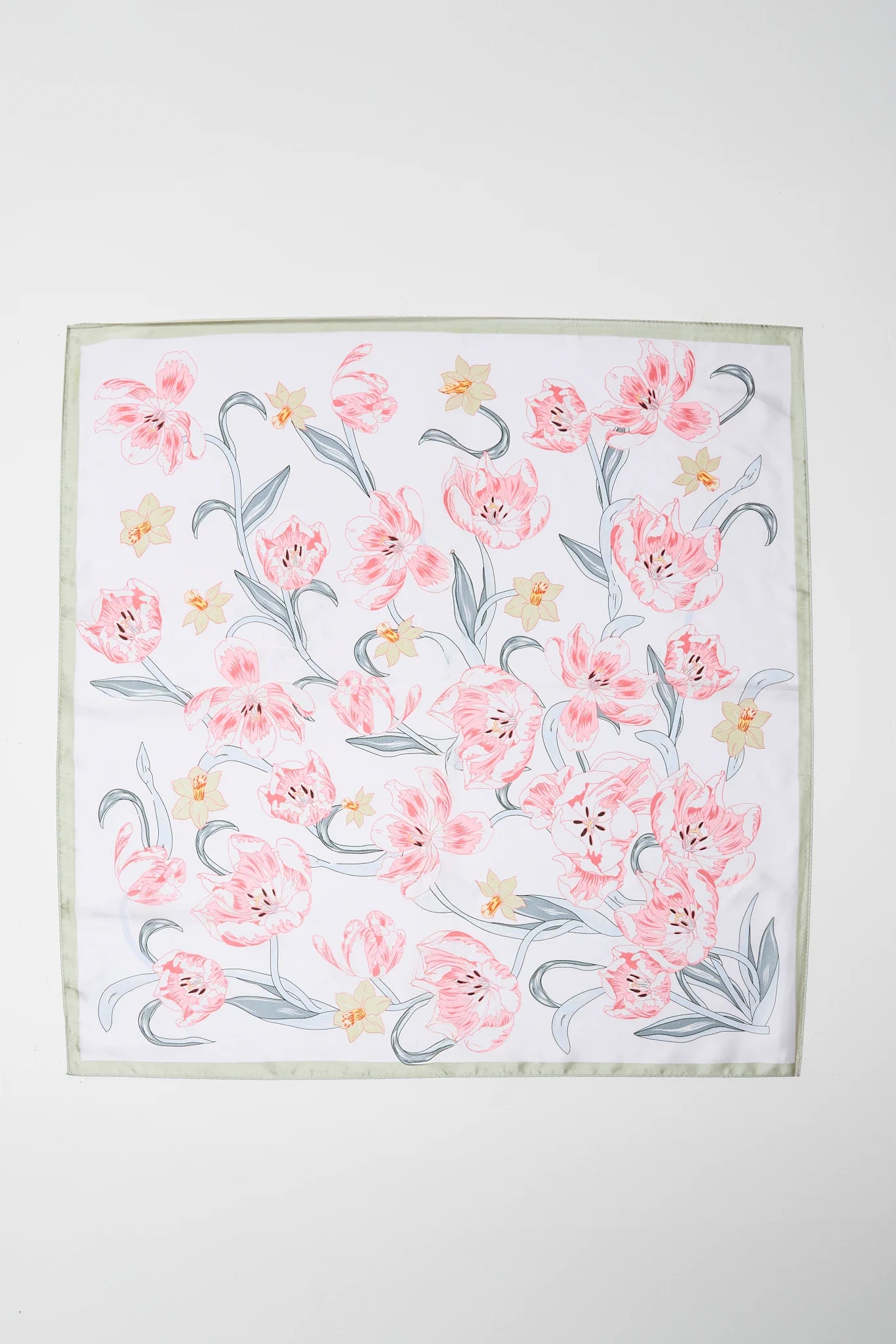 Layla Pink Floral Print Scarf featuring a square shape with pink tulip-like blooms and pale yellow flowers, perfect for versatile styling in hair or on bags.